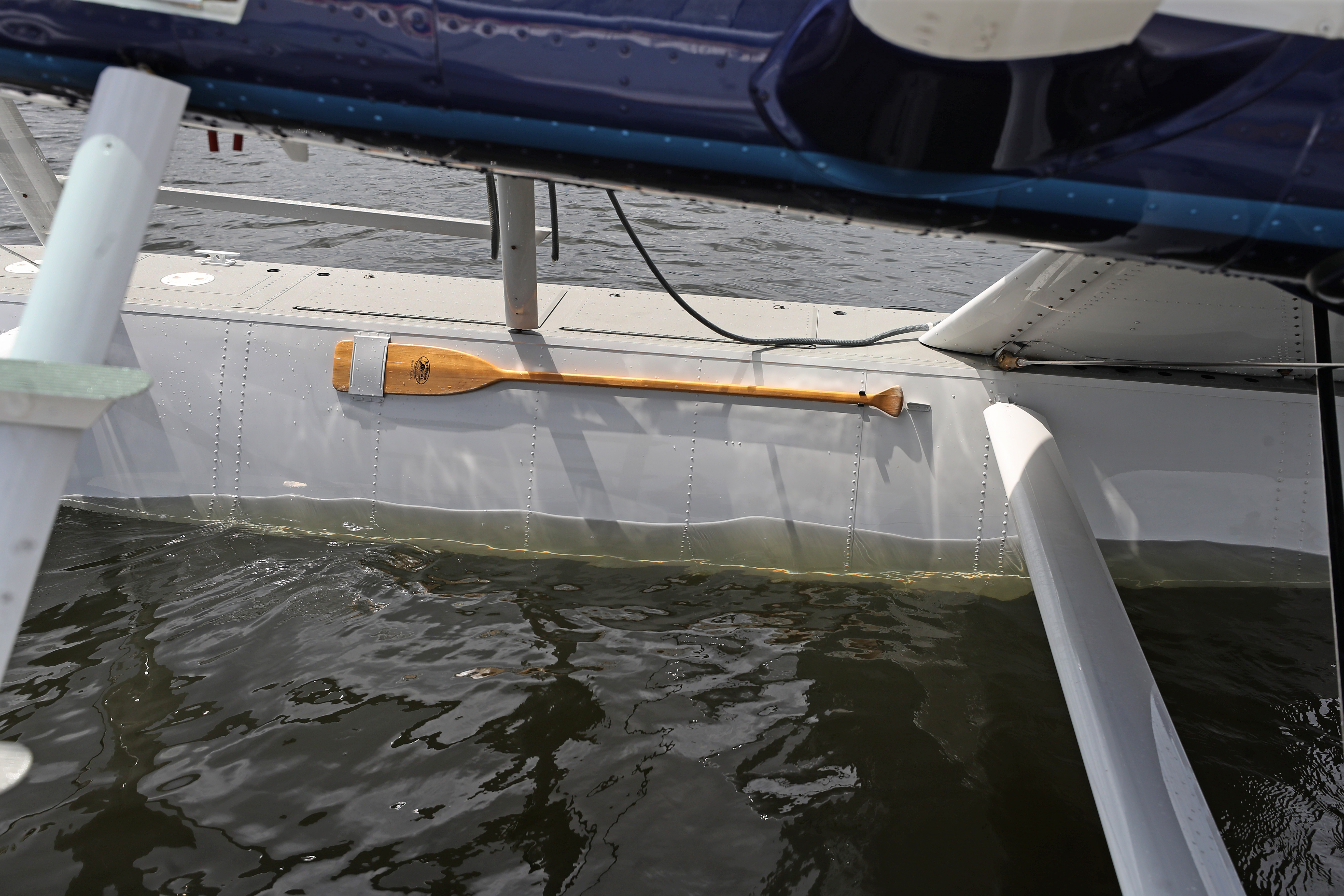 A paddle attached to the float of the seaplane — just in case.