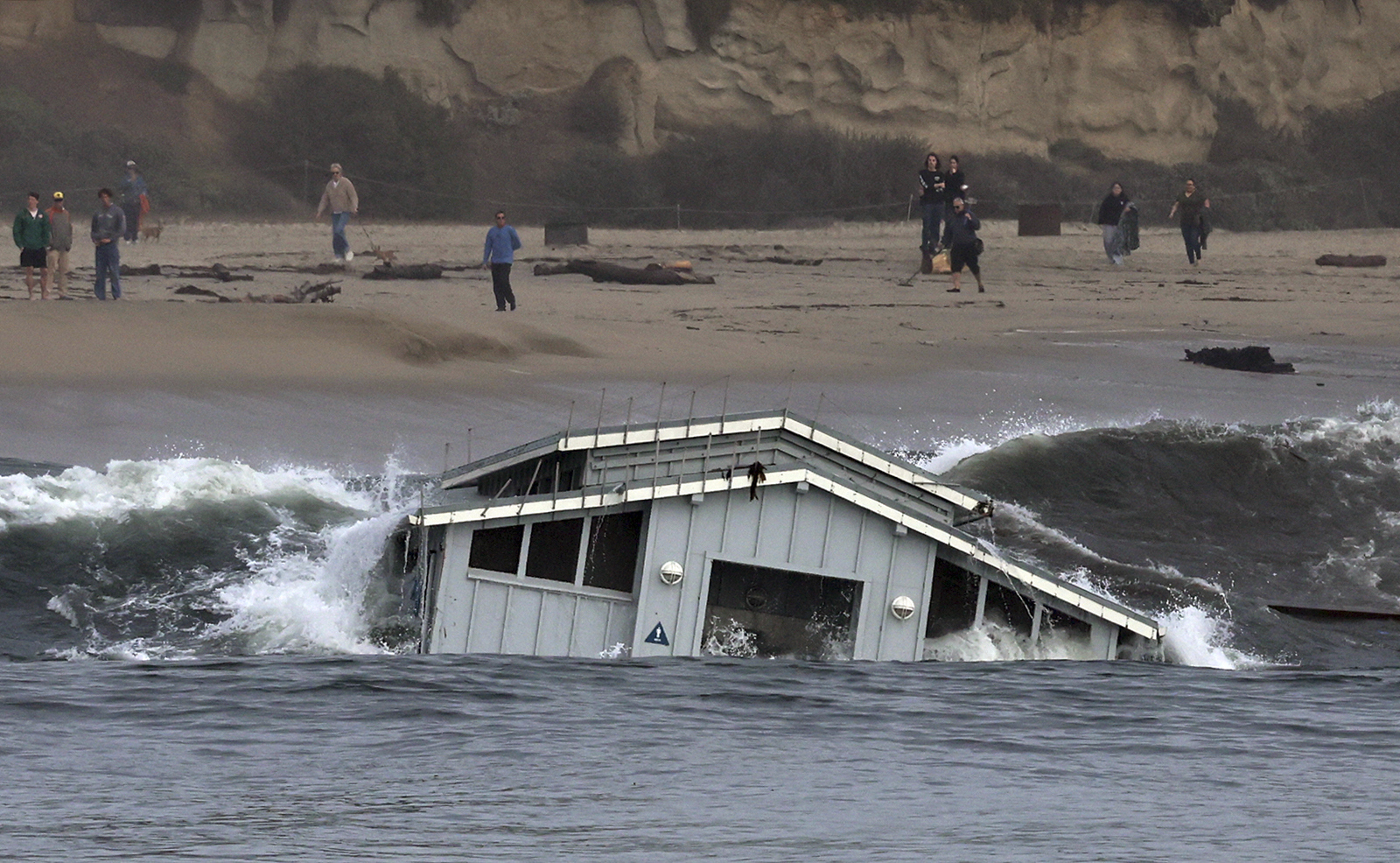 Major storm pounds California's central coast, partially collapsing pier