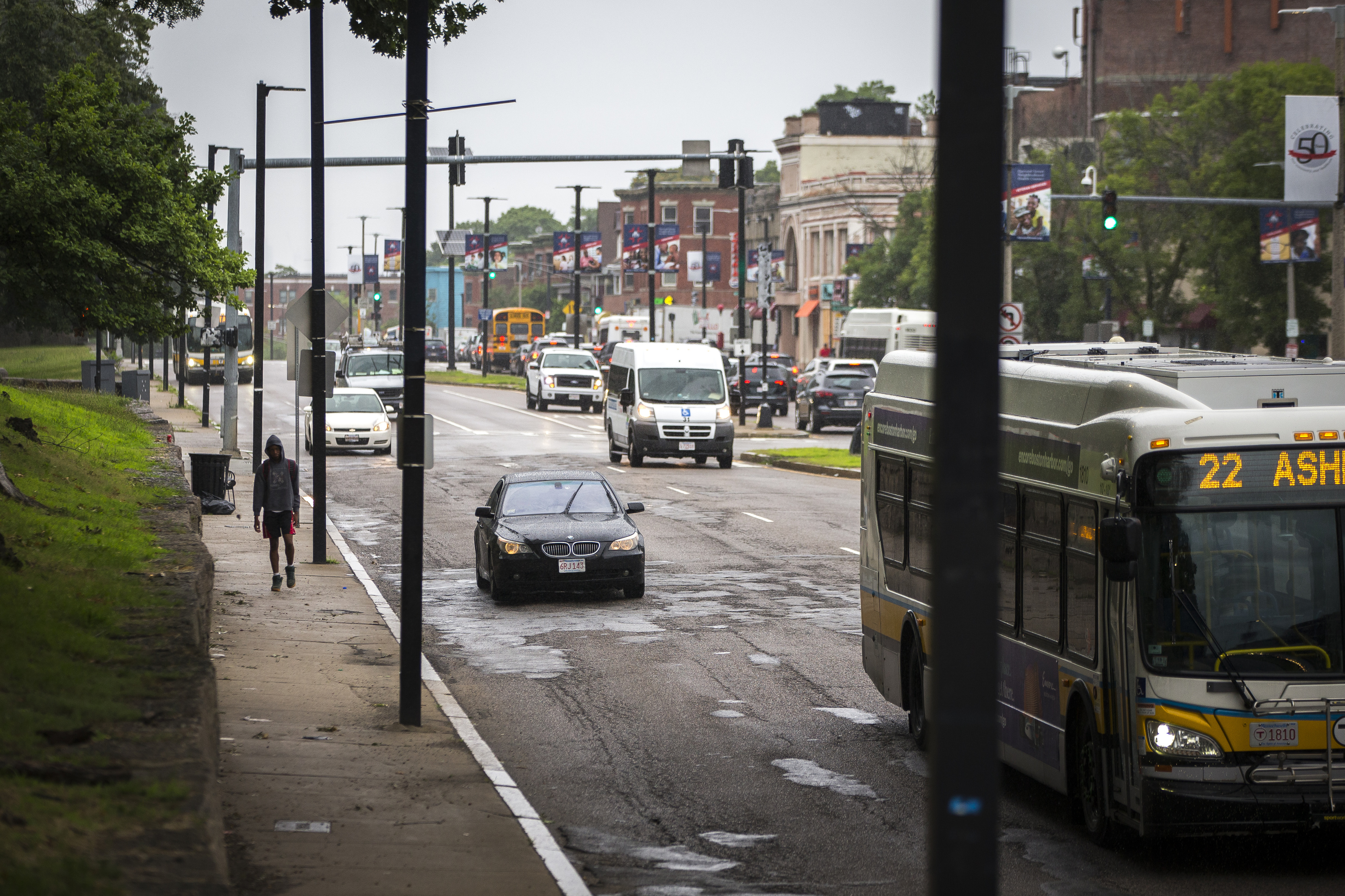 Cars drive along Blue Hill Avenue in Dorchester in 2019.