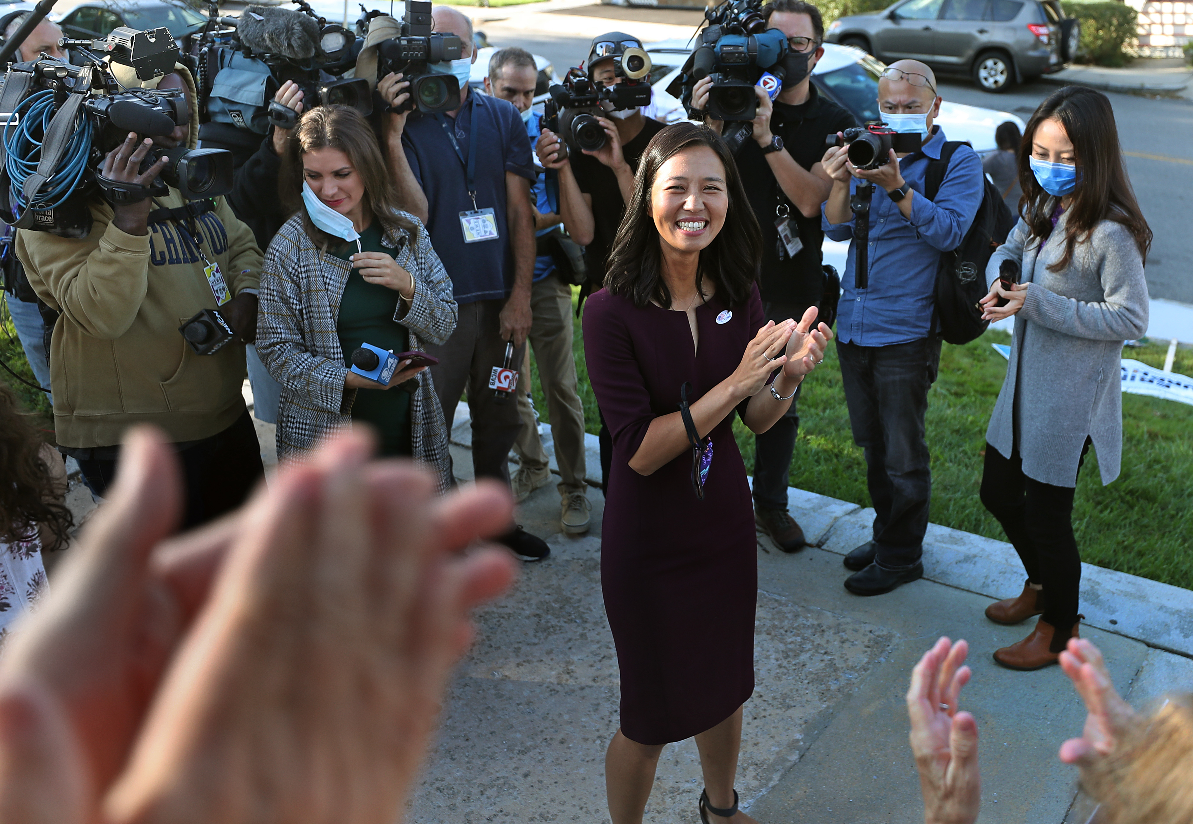 Michelle Wu voted at the Bates elementary school in Roslindale after meeting with the press. Outside well-wishers cheered her on with a round of applause.