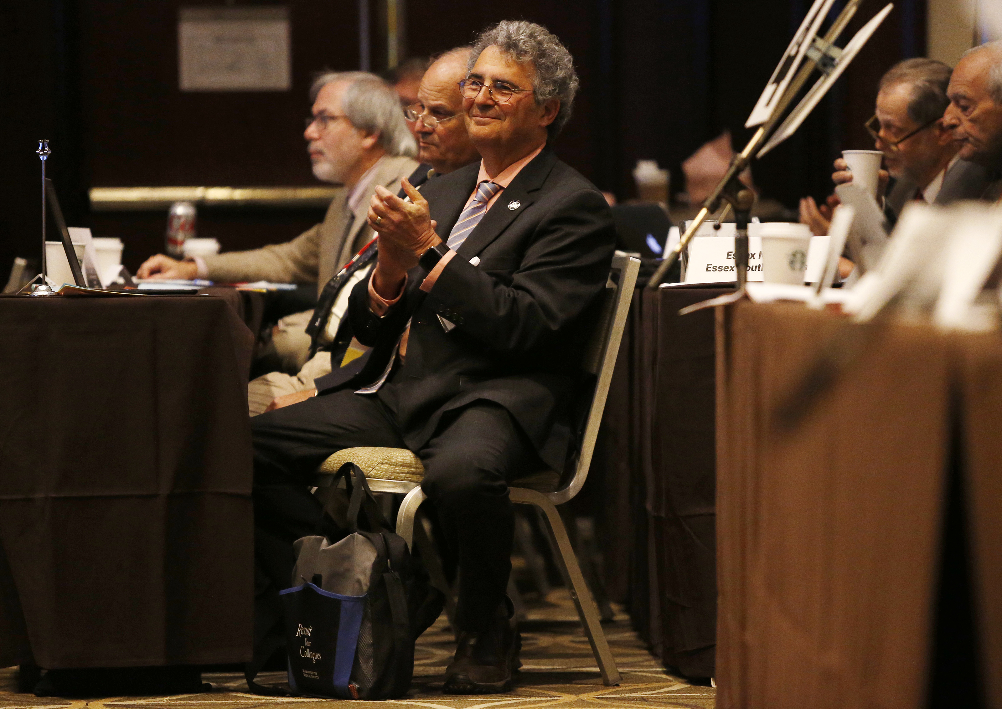 Dr. Roger Kligler reacted as members of the Massachusetts Medical Society voted to approve the first resolution in a series that would allow them to become newly neutral, not opposed, on the subject of medical aid-in-dying in 2017.