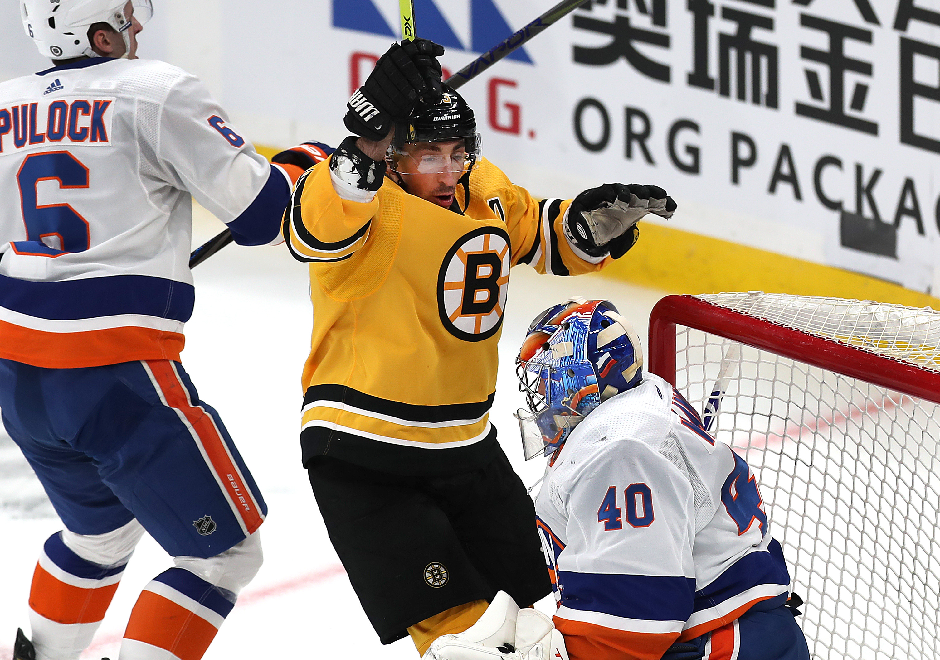 Brad Marchand celebrates his first-period goal Thursday against the Islanders.