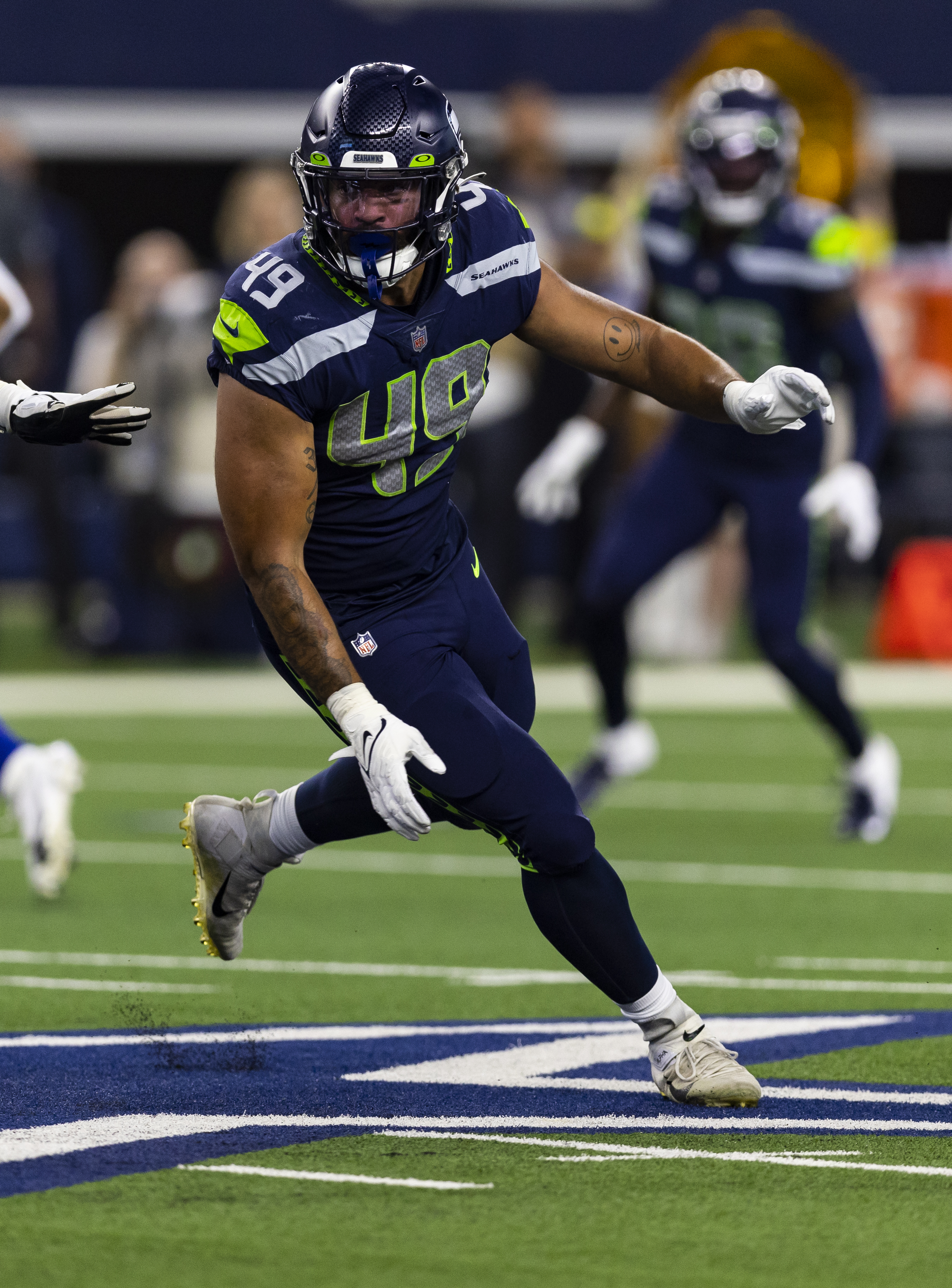 Members of the Seattle Seahawks staff escort Seattle Seahawks