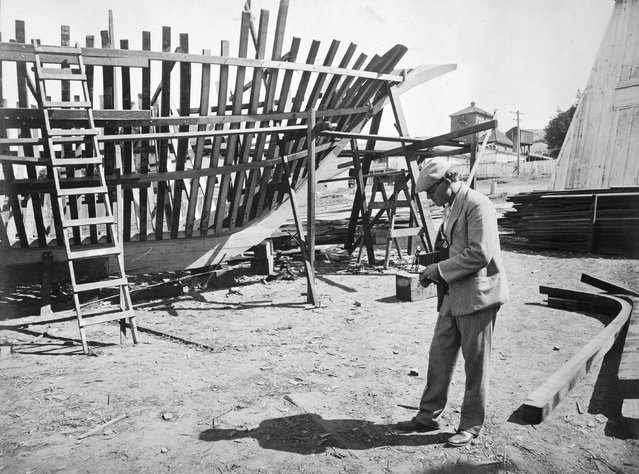 Jack London photographing the skeleton of the Snark, San Francisco Bay, 1906.