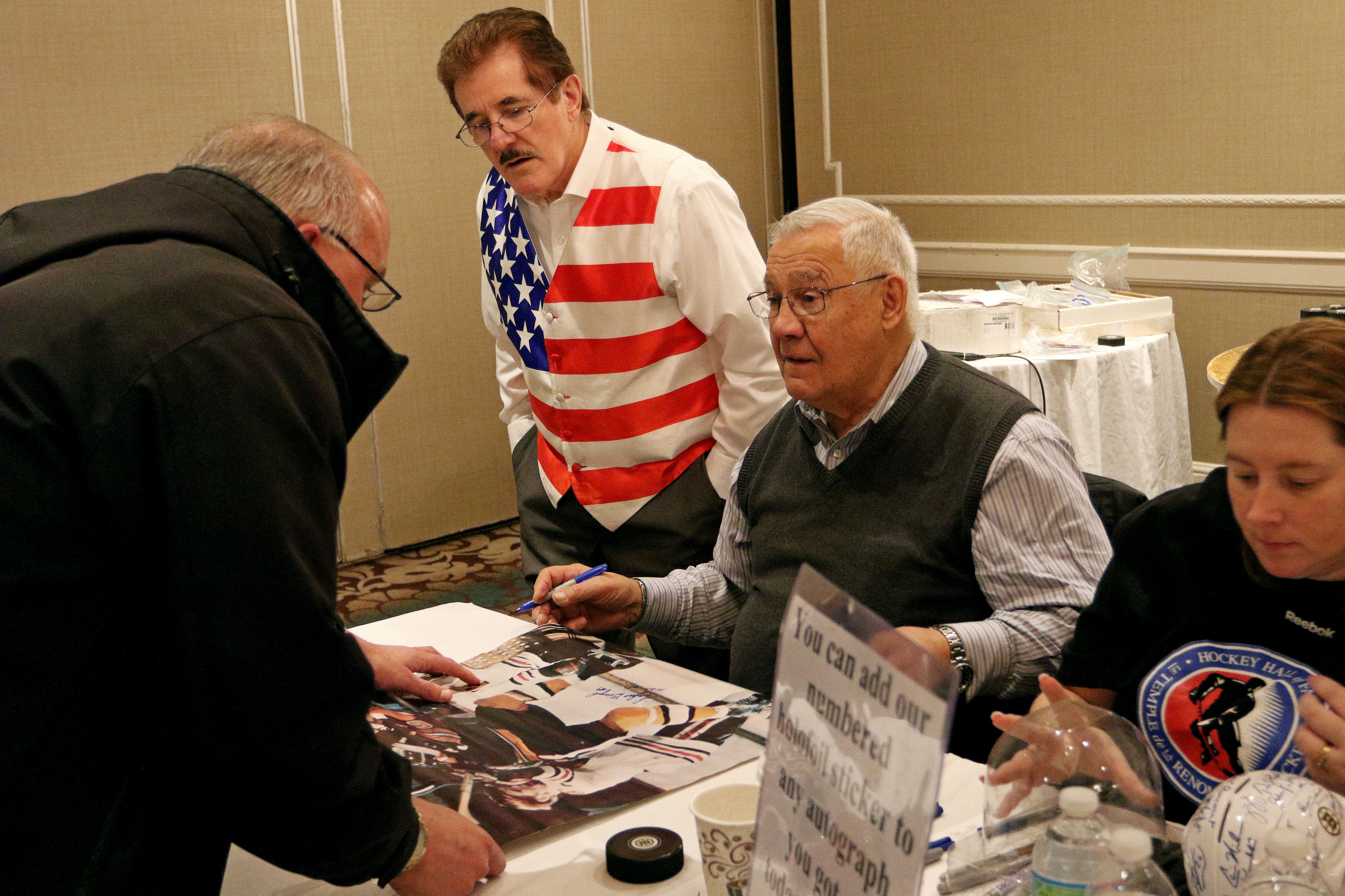 John Bucyk, center, signed autographs at the Holiday Inn in Mansfield in 2014.