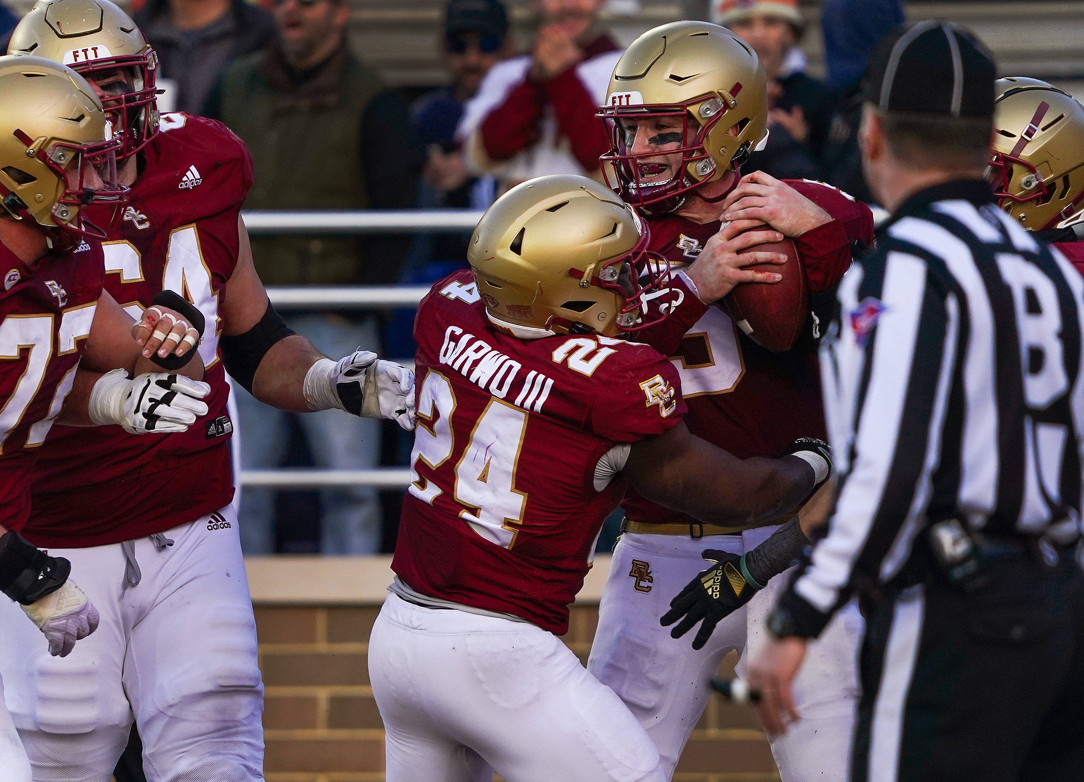 Boston College quarterback Phil Jurkovec and teammates celebrate after the quarterback’s 3-yard run for a touchdown in the fourth quarter.