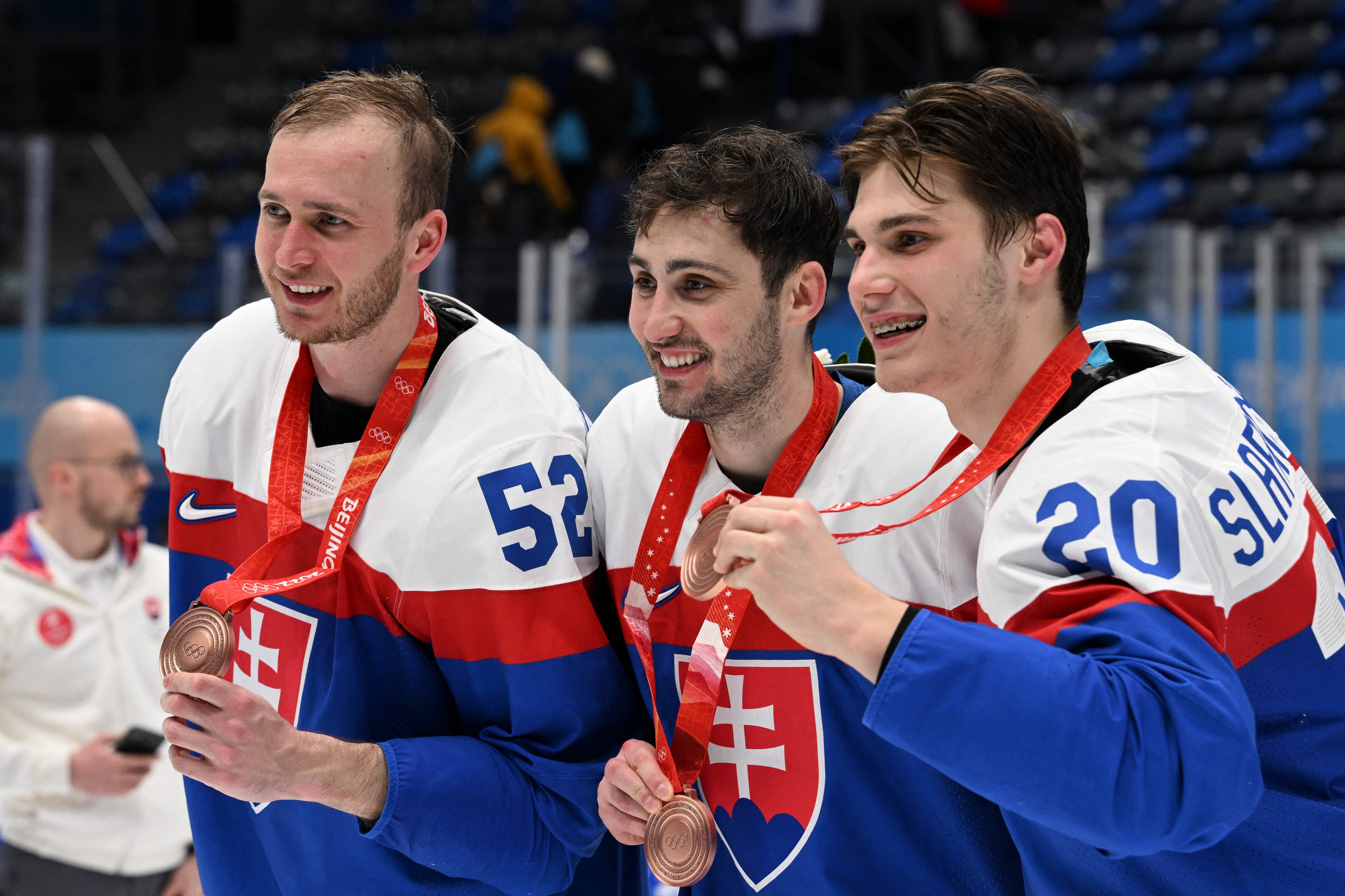 Beijing, China. 19th Feb, 2022. Juraj Slafkovsky (R) of Slovakia celebrates  with his teammates during the ice hockey men's bronze medal game of Beijing  2022 Winter Olympics between Sweden and Slovakia at