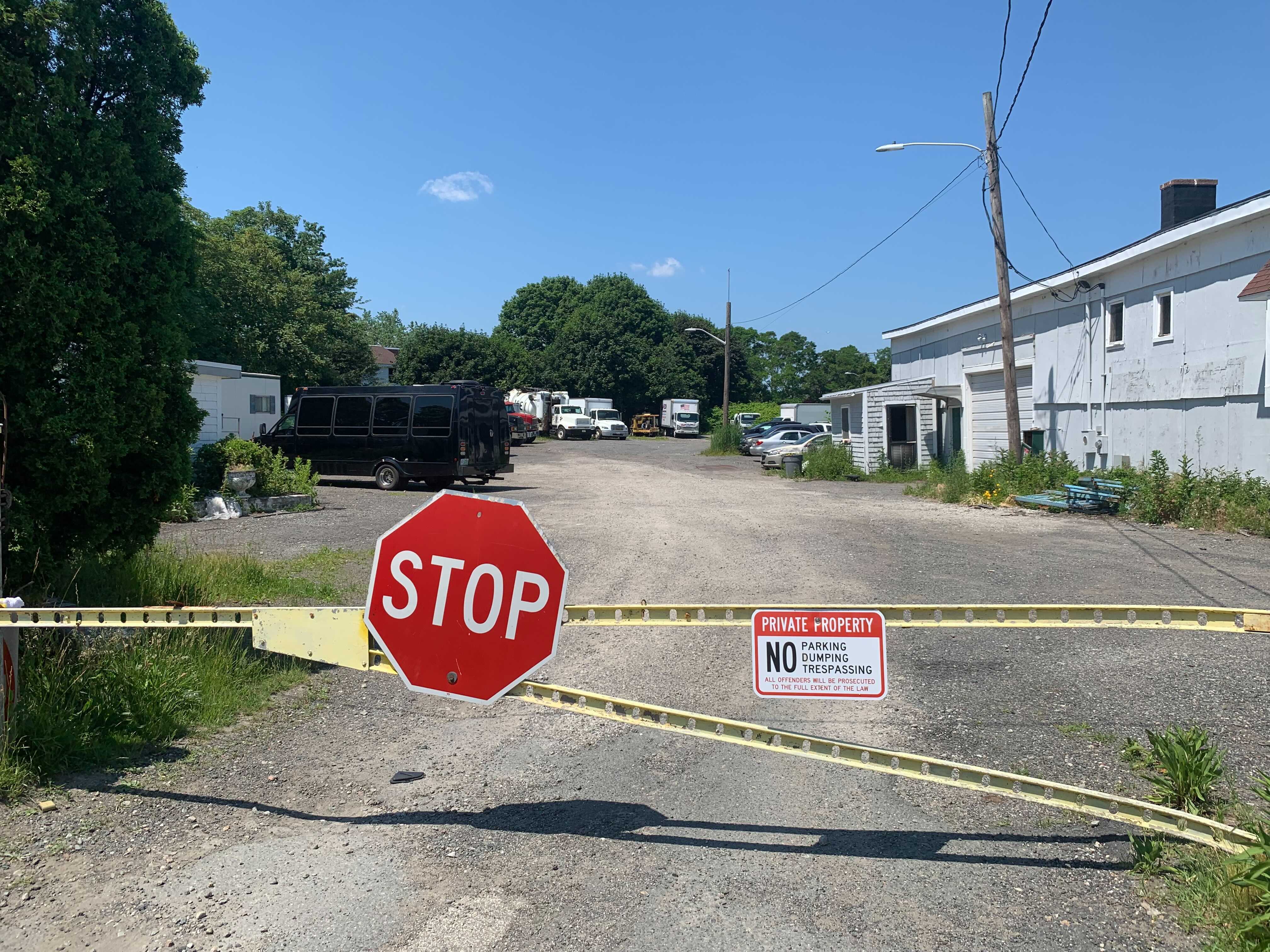 A metal gate to auto repair shops on Argyle Street in Winthrop. Police believe Nathan Allen stole a box truck from the lot and made his way to nearby Shirley Street.
