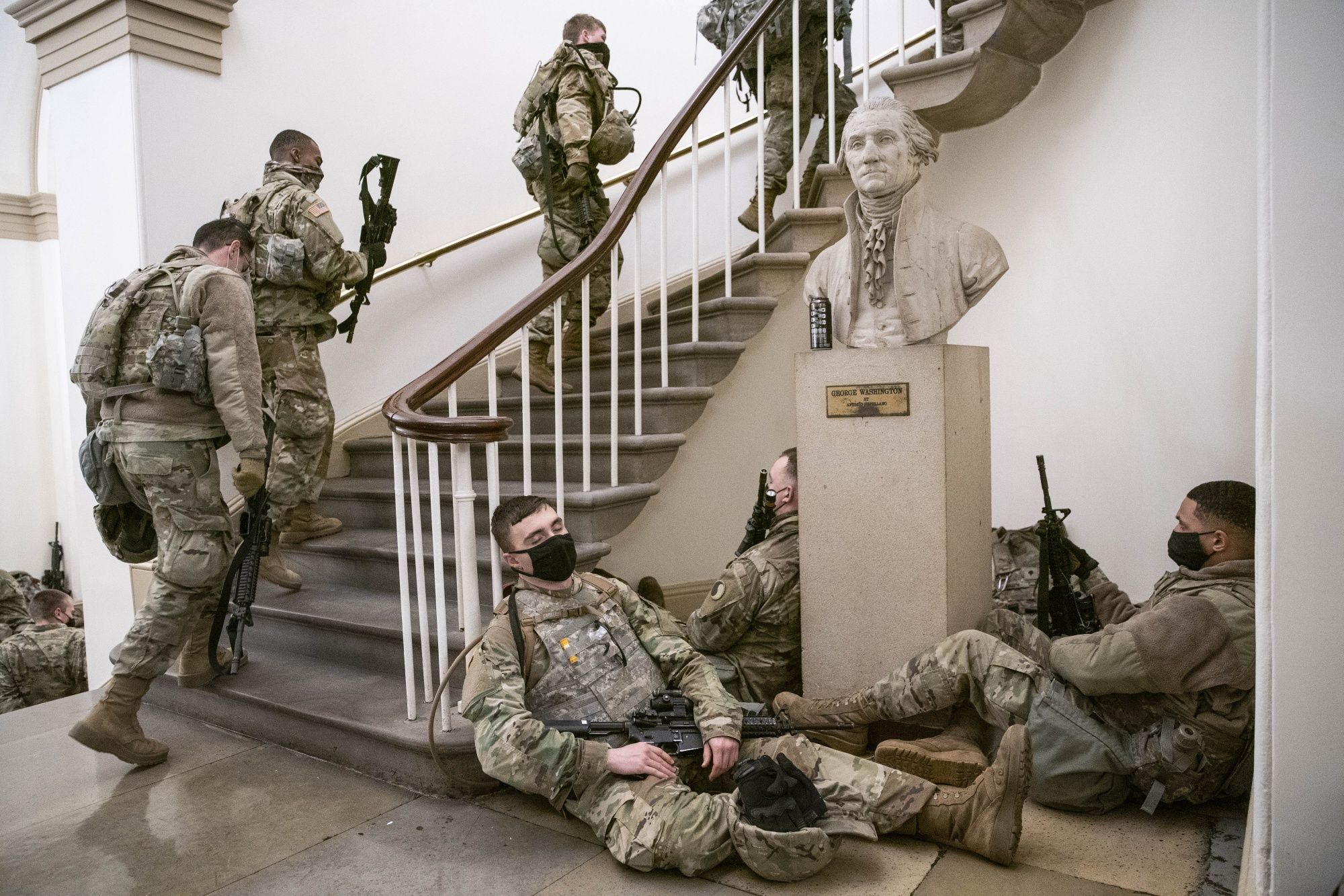 Members of the National Guard ascended a staircase at the US Capitol.
