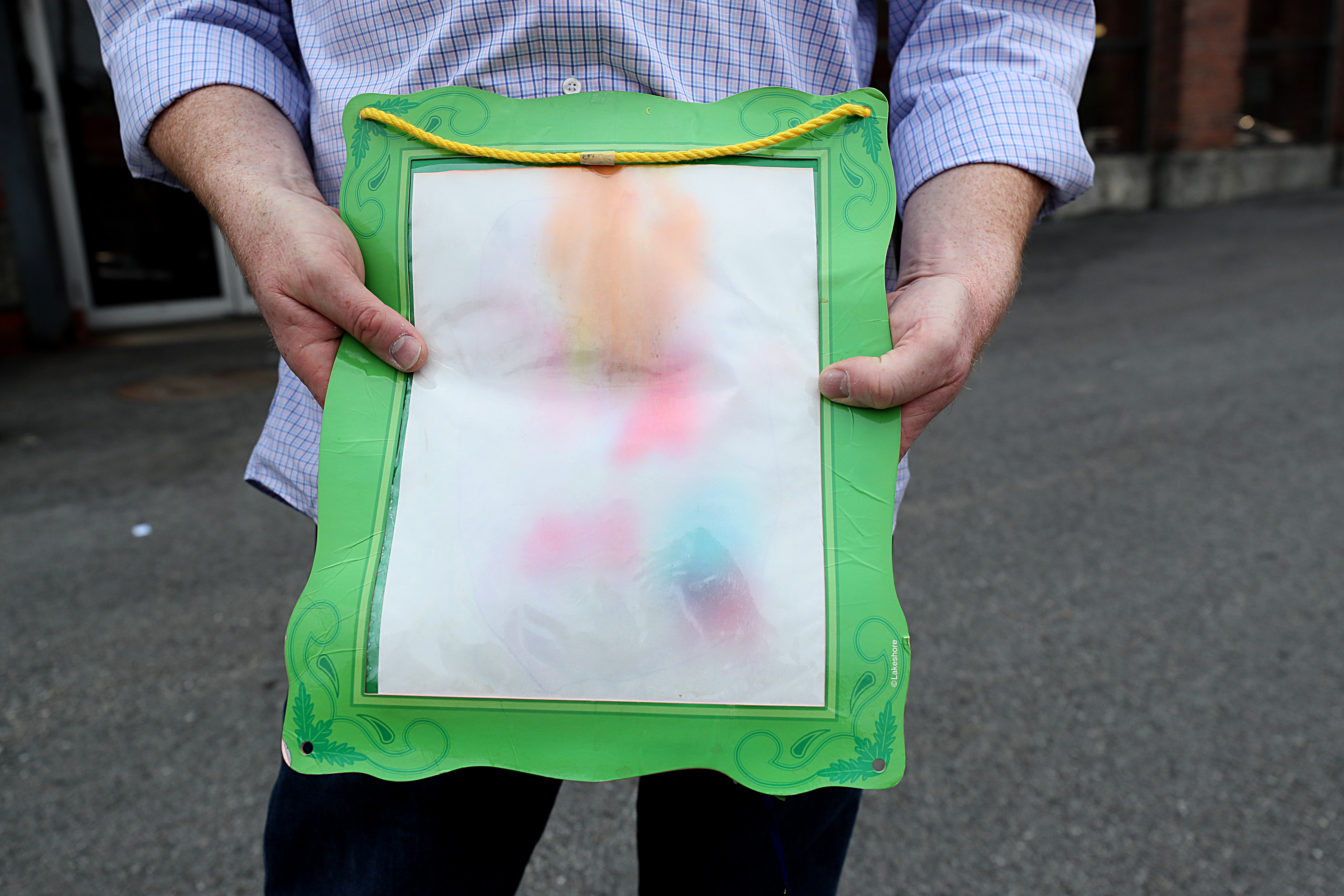 Scott Goldman held a ruined piece of art work from one of his children.