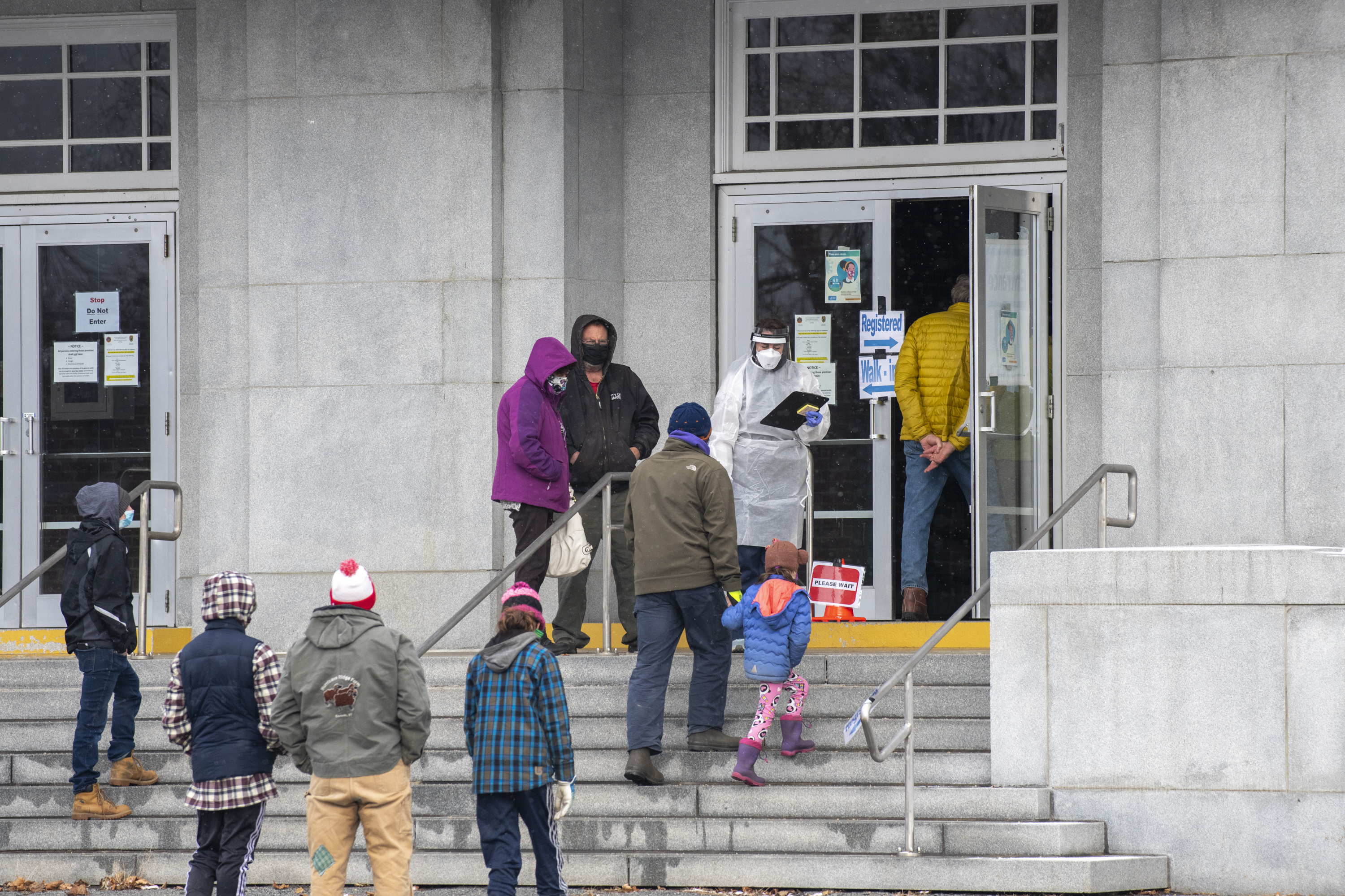 People entered the Barre Municipal Auditorium for COVID tests.