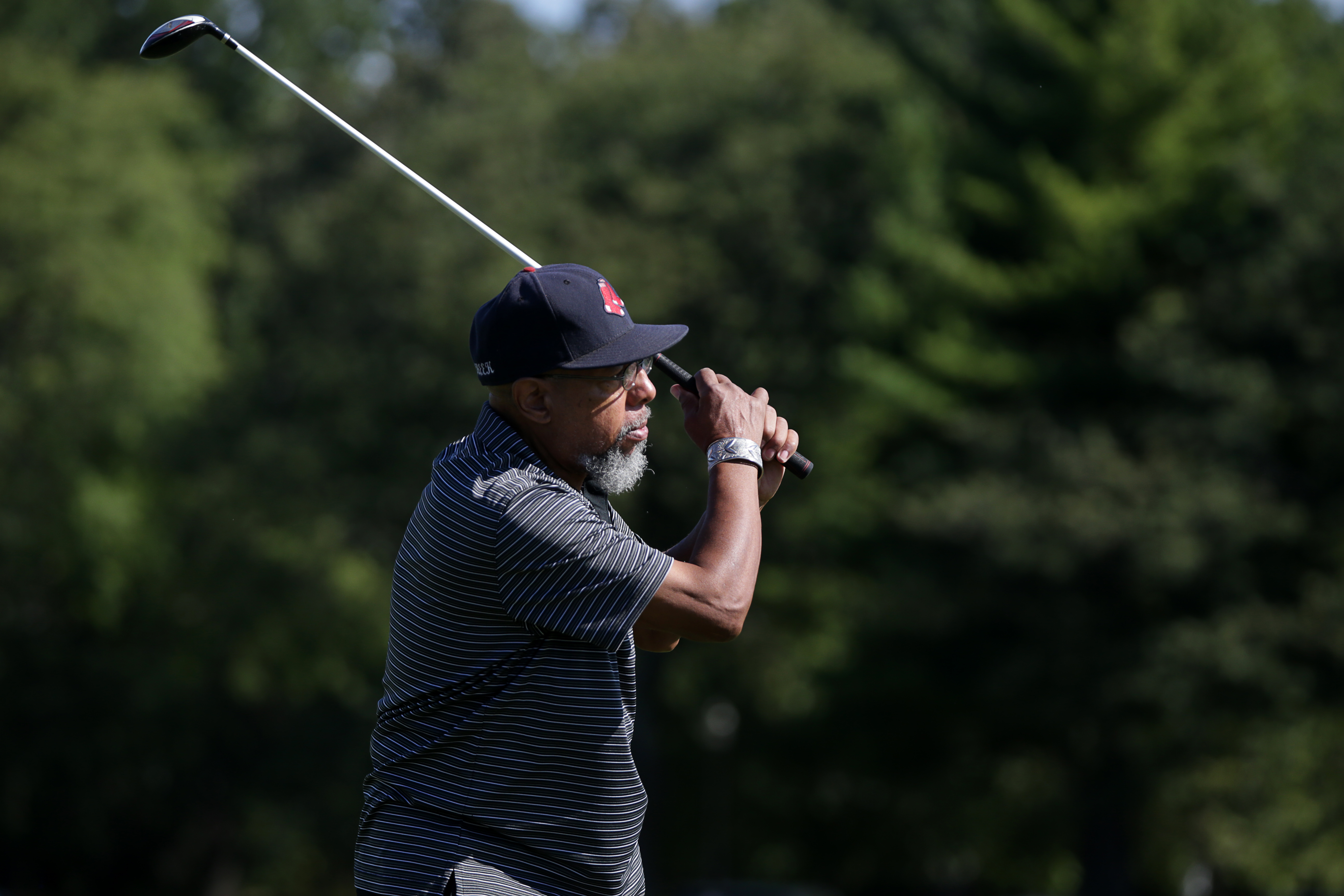 Raymond Cheek teed off while playing a round of golf at the William J. Devine Golf Course.