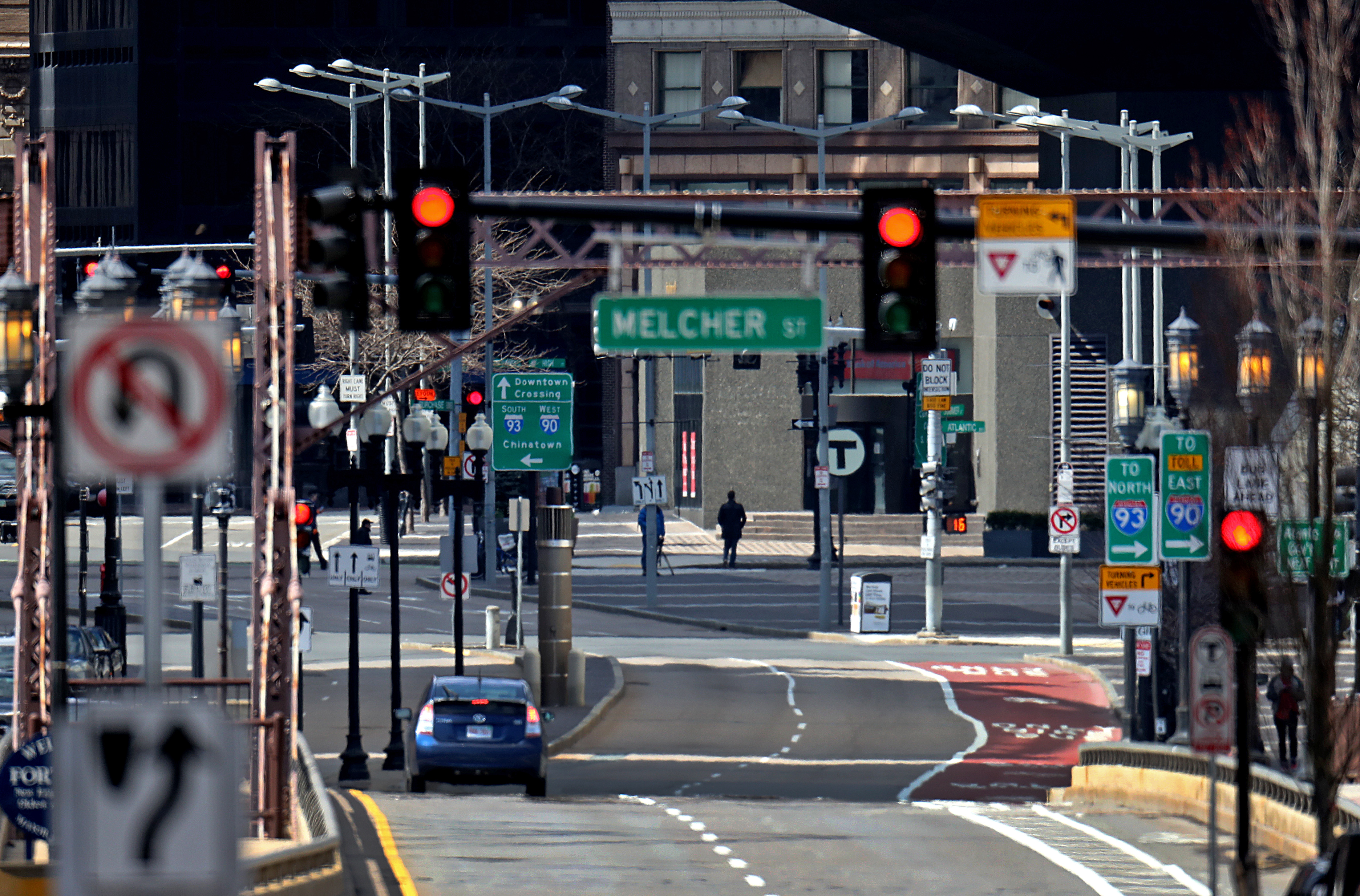 BOSTON, MA - 3/31/2020: A just about empty Summer street during the mid afternoon traffic hour viewed from the Fort Point Channel towards downtown Boston because of CORVID-19 coronavirus pandemic.  (David L Ryan/Globe Staff )