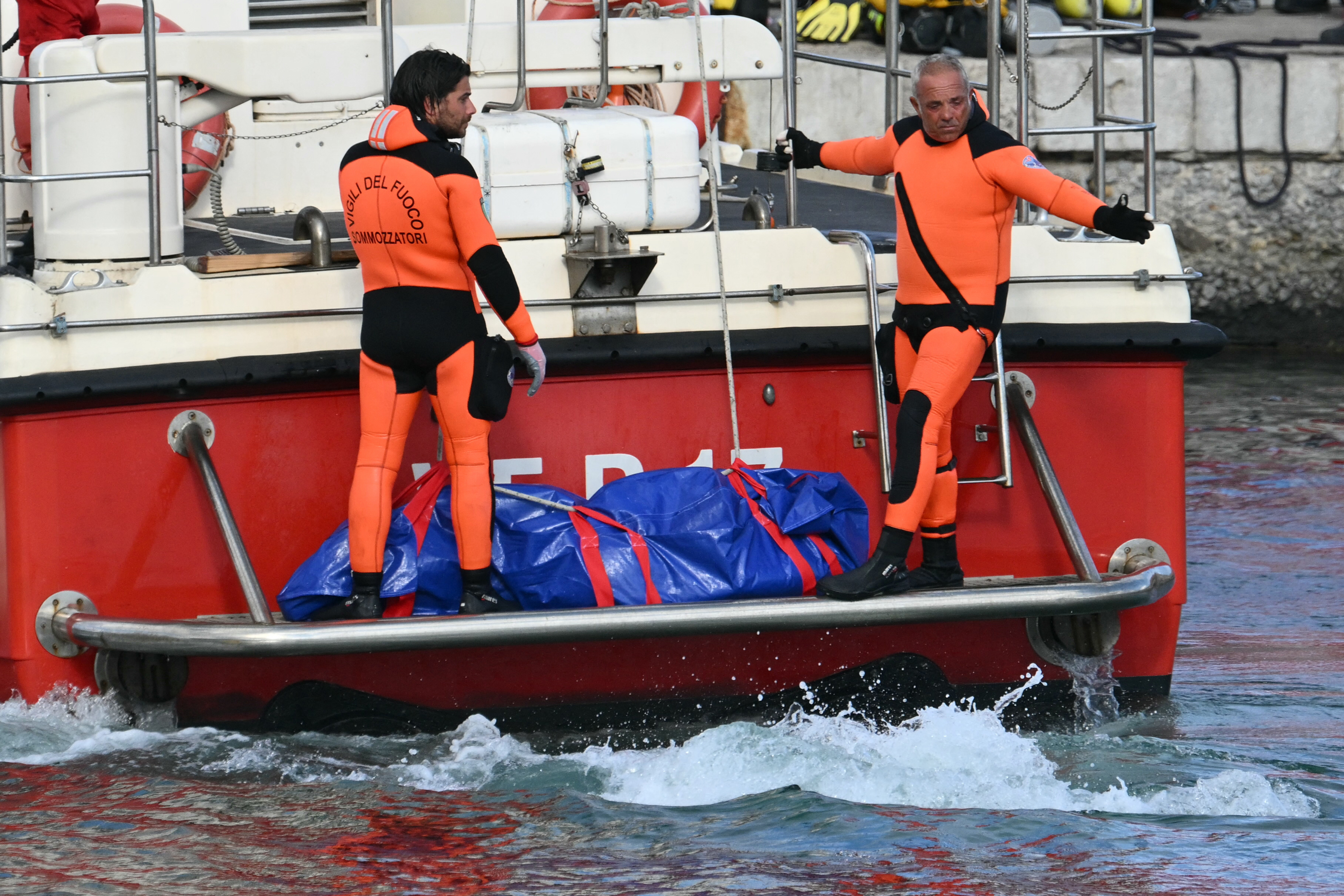 Divers find 5 bodies during search of superyacht wreckage after it