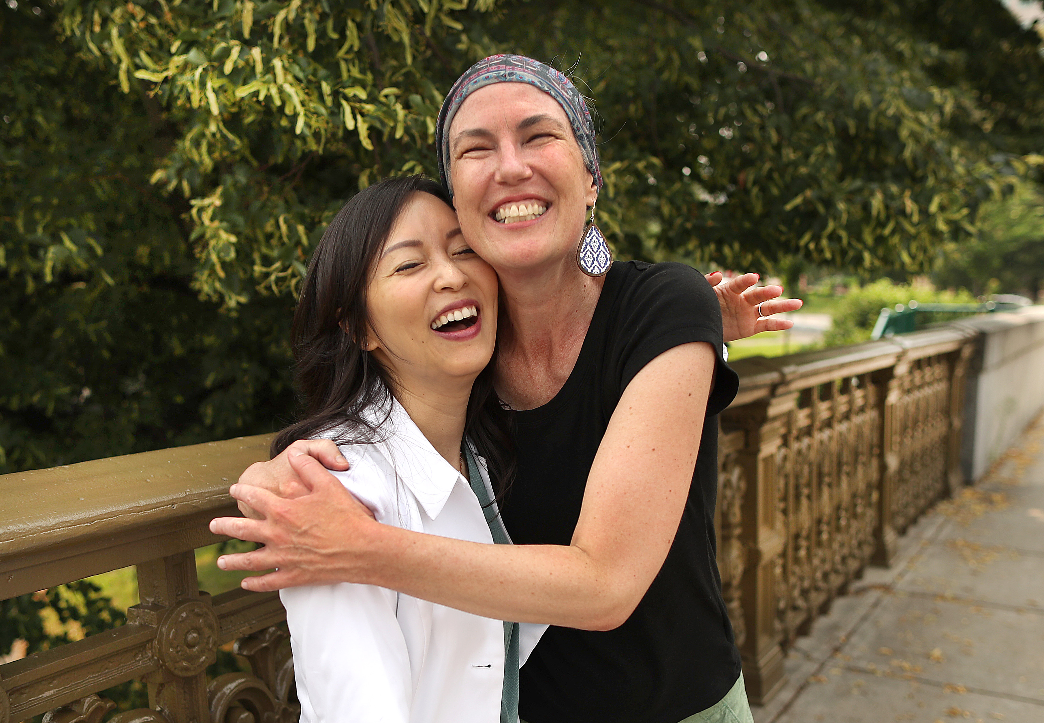 Breast cancer patient Carlin Carr hugged her radiation oncologist, Dr. Alice Ho, who joined Carr for the last leg of her journey to MGH on her last day of treatment.
