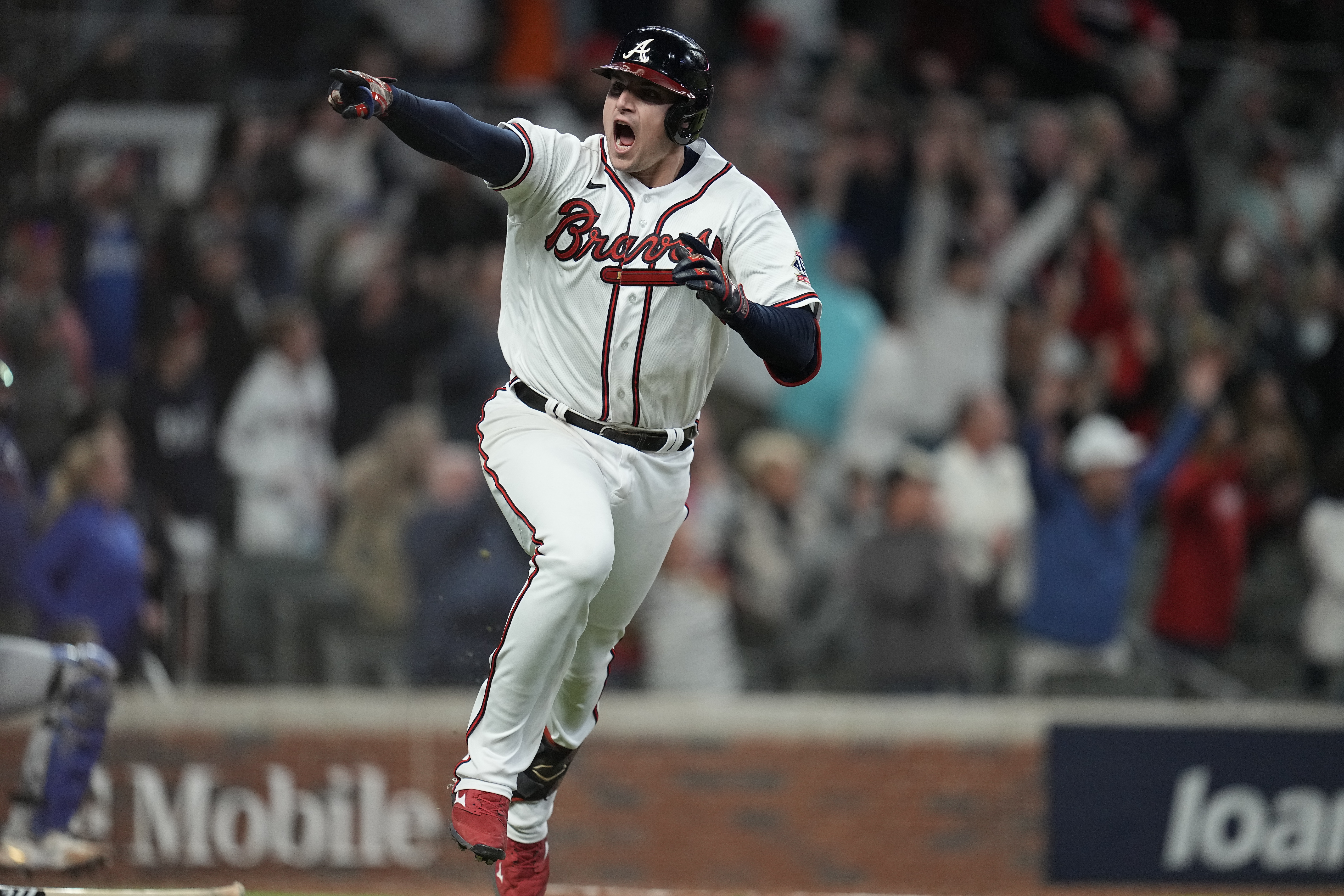 Austin Riley of the Atlanta Braves celebrates with teammates after