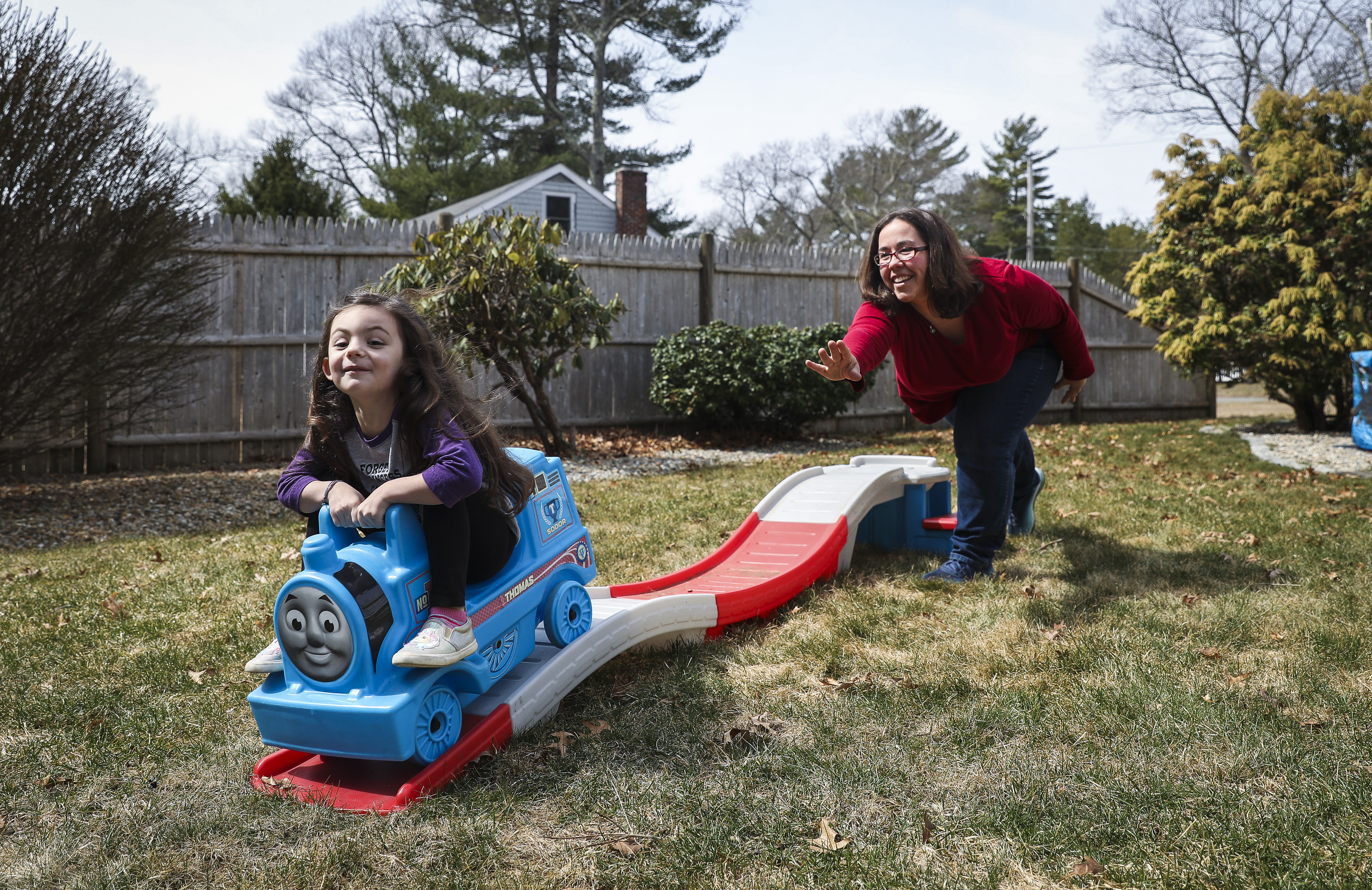 Alysia Shanahan-Belisle played with her 4-year-old daughter, Teagan, outside of their Pembroke home.