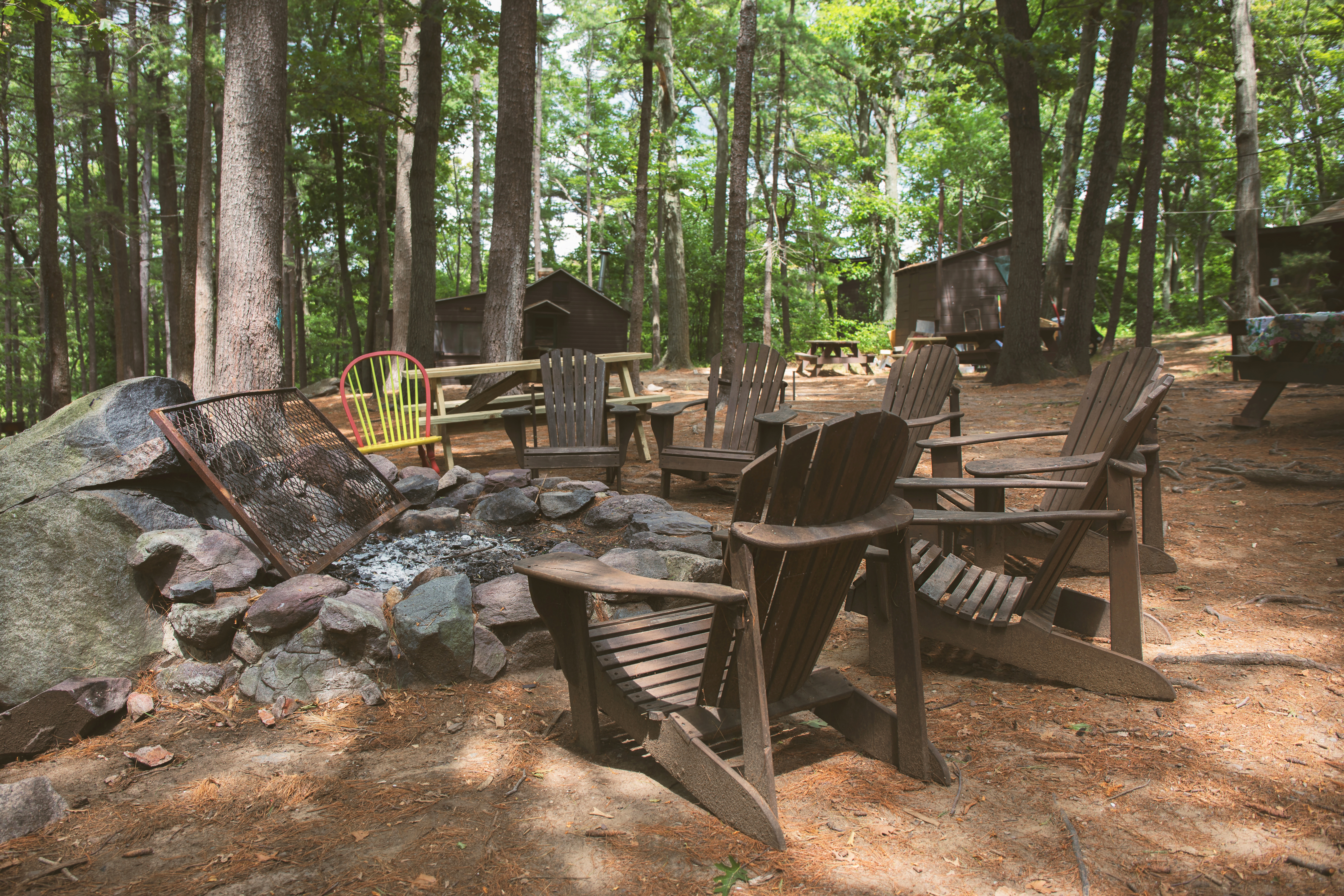 After a day playing outdoors, grab a seat around the firepit at the AMC Ponkapoag Camp.