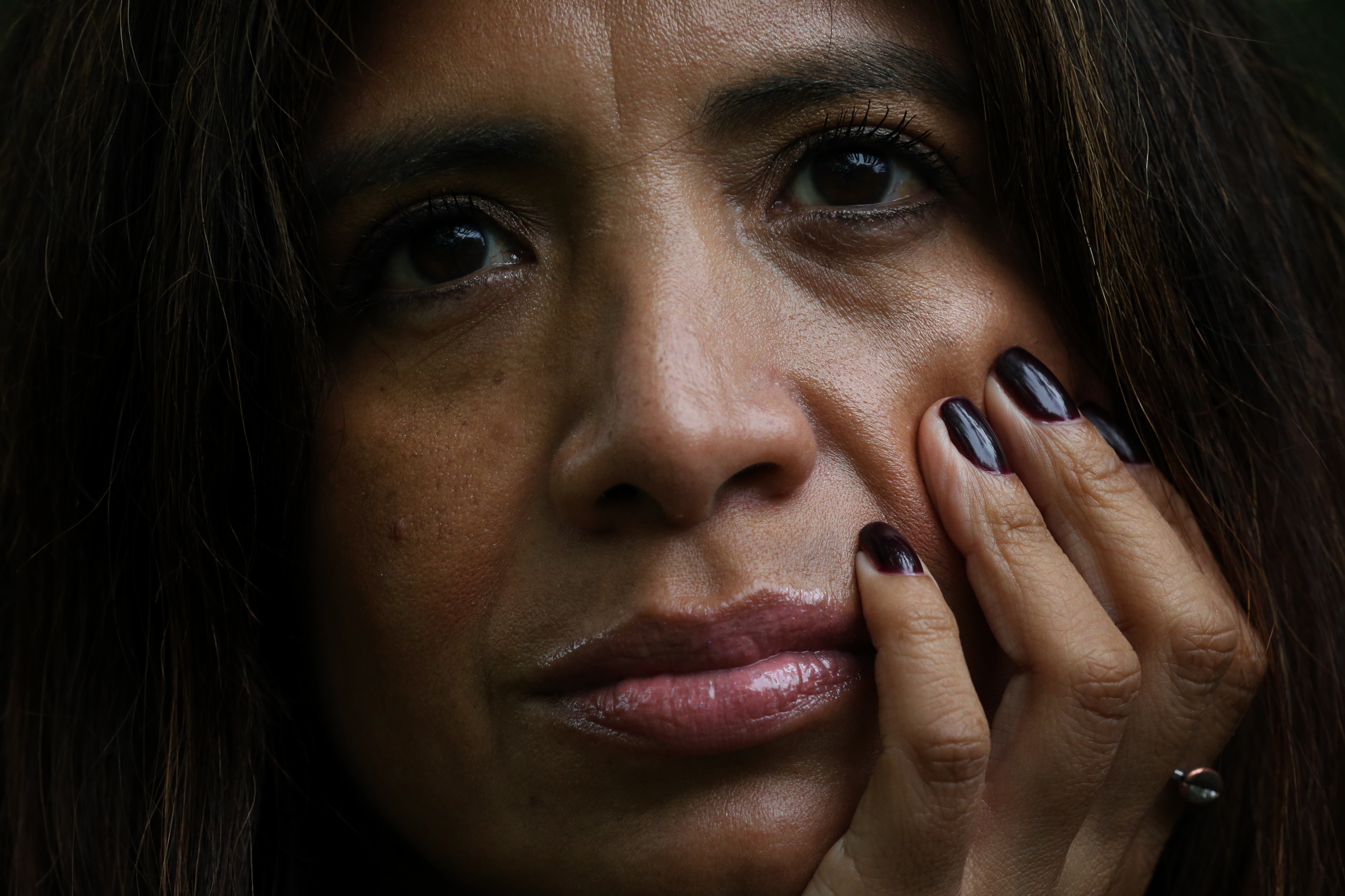 Stephanie Holland posed for a portrait after having her nails done in memory of her mother.