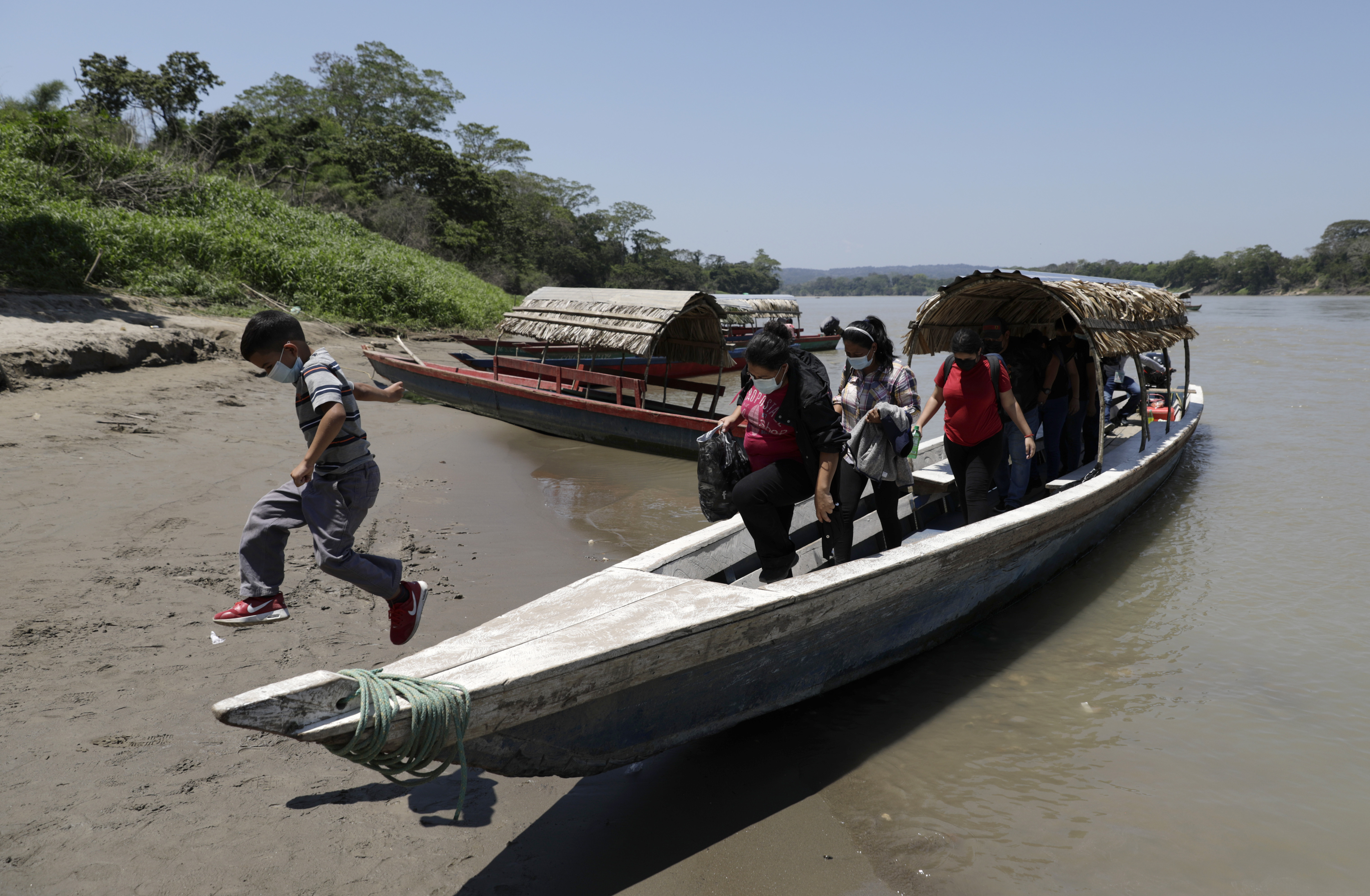 Migrants disembark on the Mexican side of the border after crossing the Usumacinta River from Guatemala, in Frontera Corozal, Chiapas state, Mexico on Wednesday.