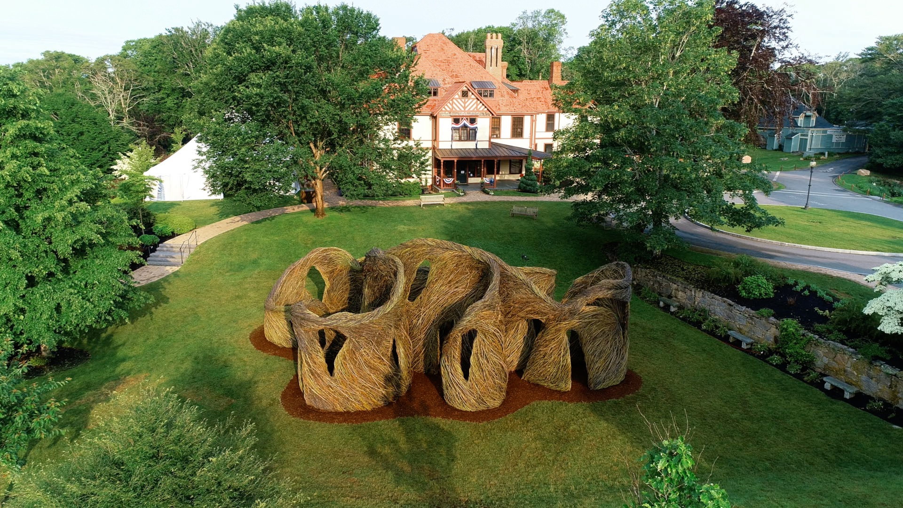 An aerial view of "A Passing Fancy," Patrick Dougherty's stick sculpture on the lawn of Highfield Hall & Gardens.