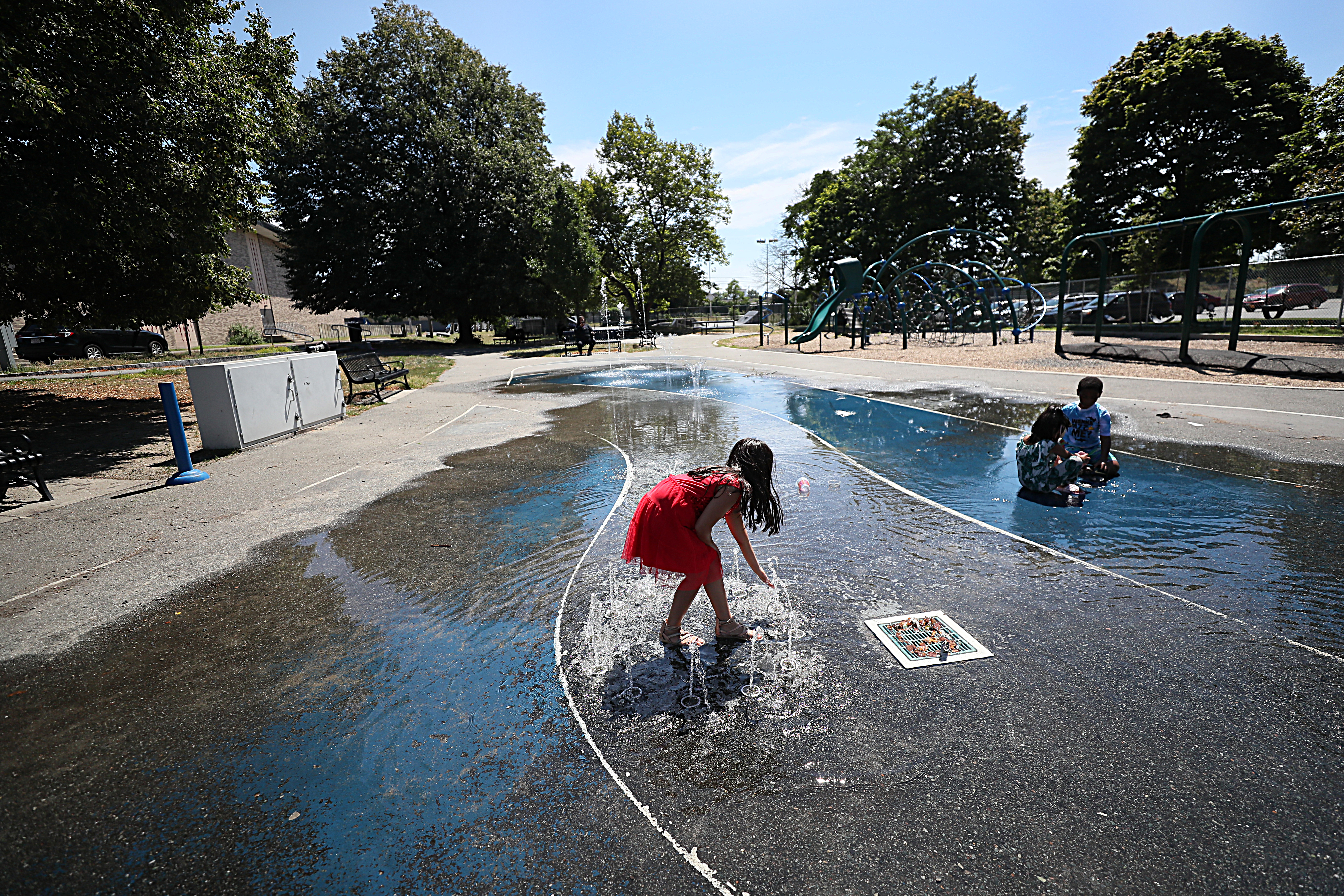 Children play at Neptune Boulevard Park in Lynn.