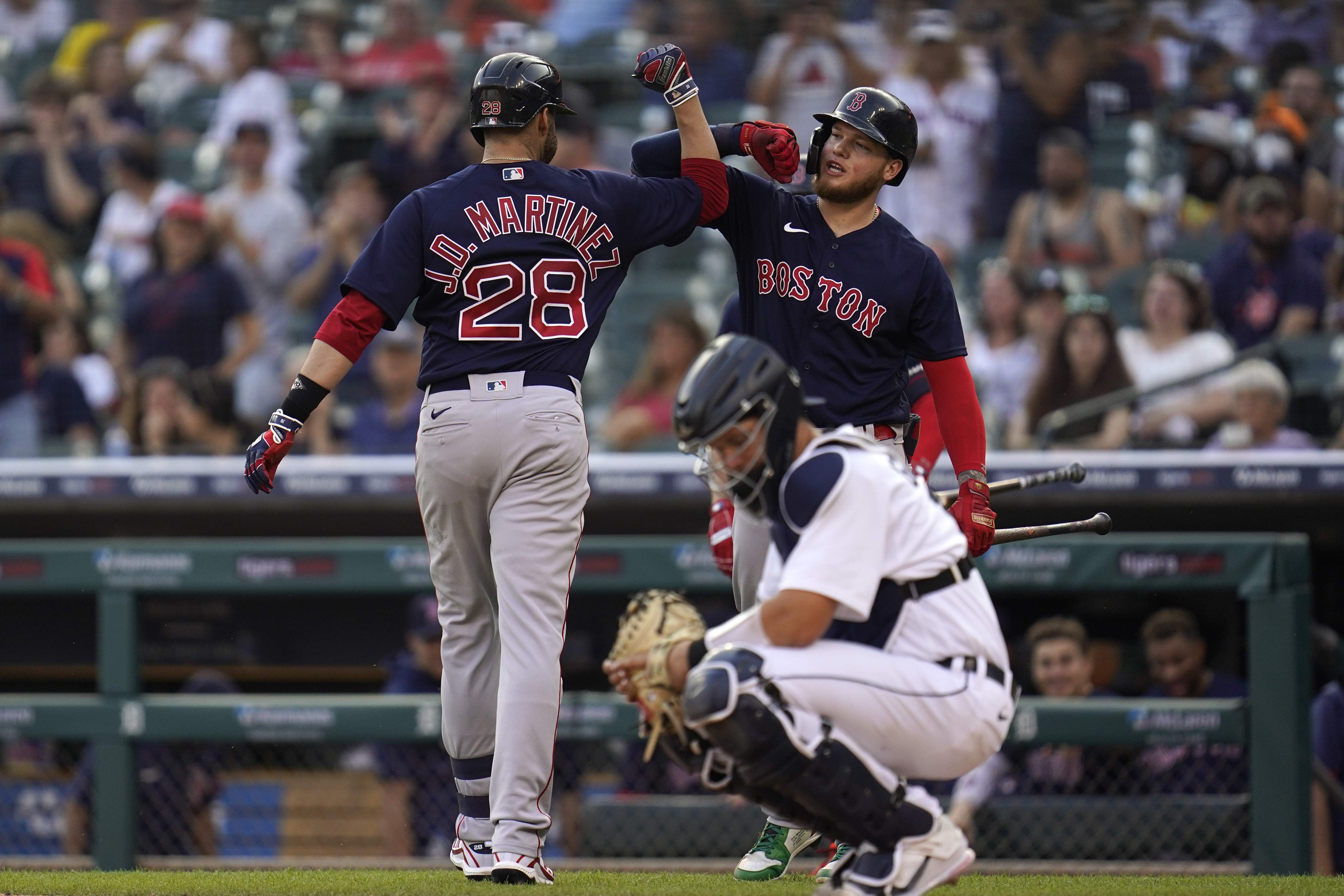 J.D. Martinez celebrates his solo home run with Alex Verdugo in the second inning of Wednesday's game.