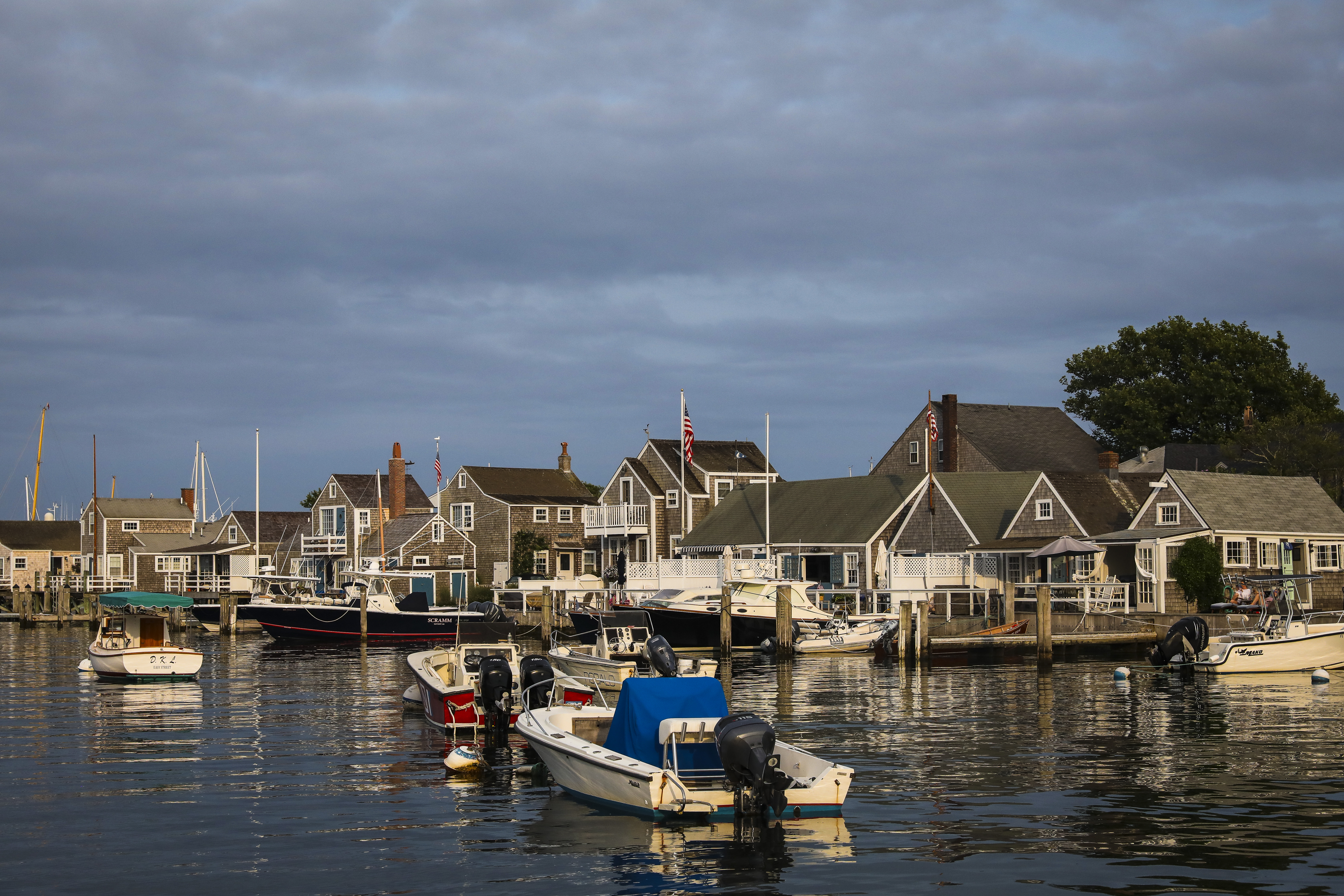 Evening light falls on boats as they bob in the harbor in Nantucket.