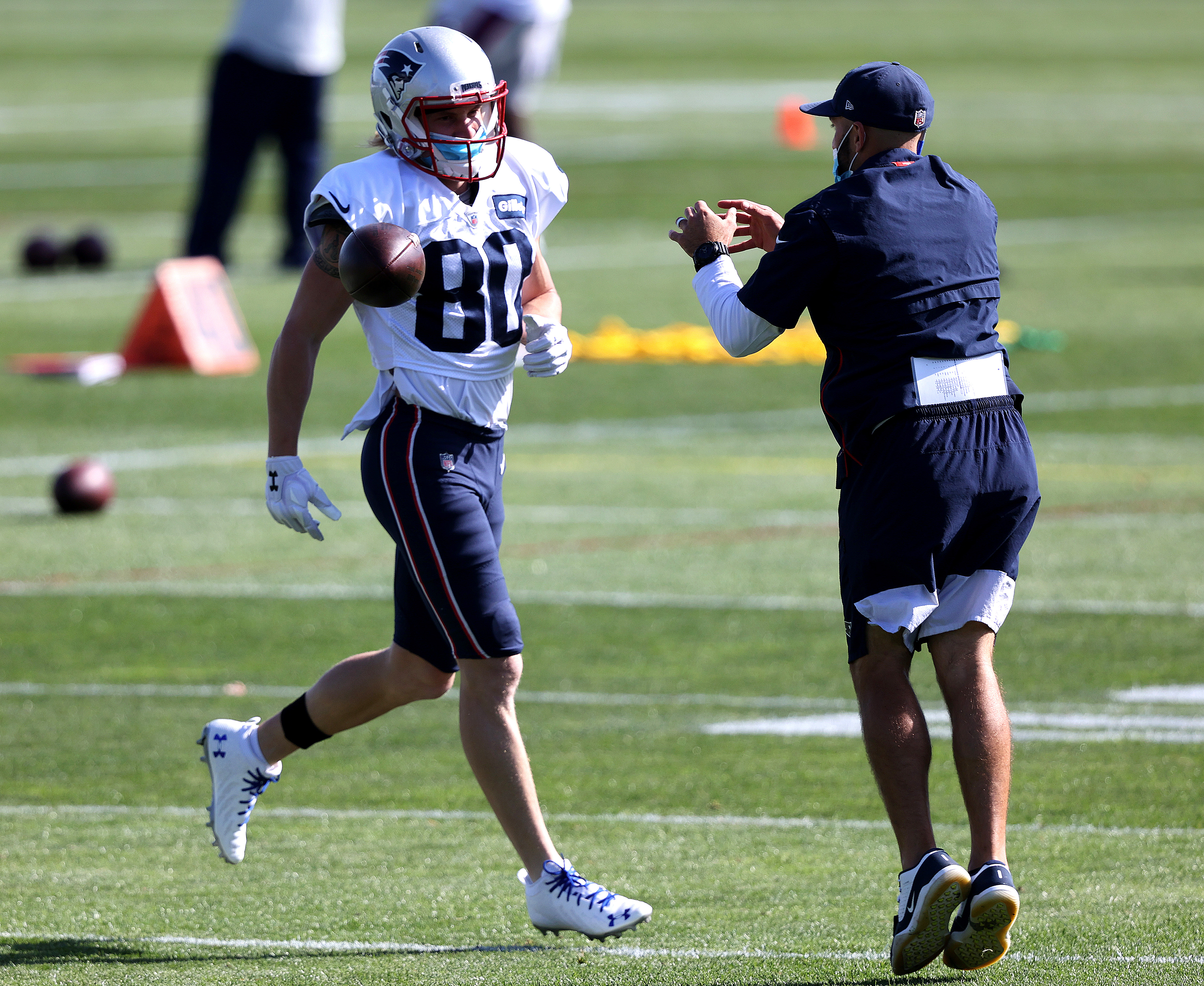Gunner Olszewski works through drills in helmet and shells during a Thursday practice.