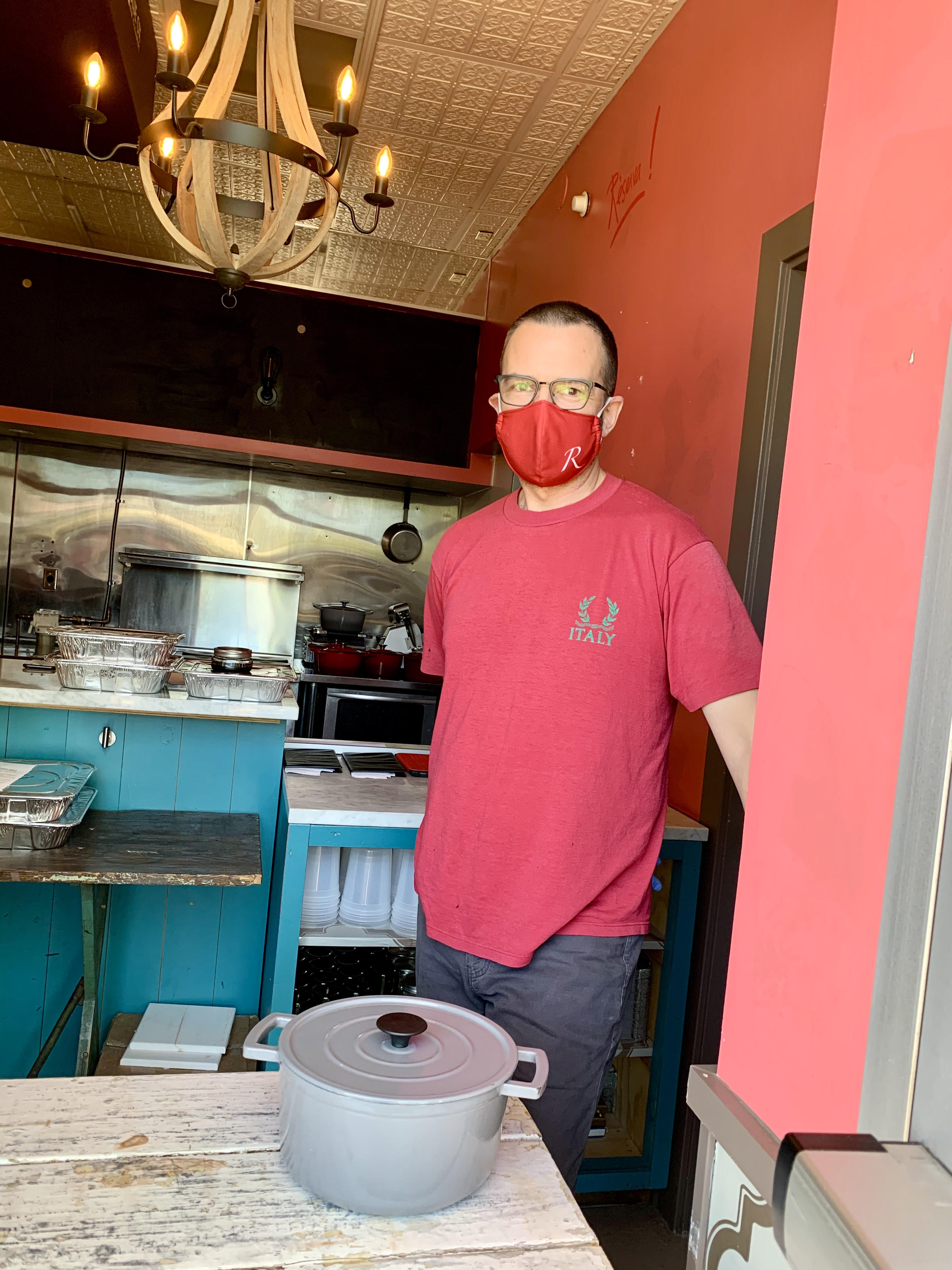 Ron Suhanosky of Chef Ronsky's in Chestnut Hill serves takeout dinner in a Dutch oven; customers are asked to return them in a day or two.