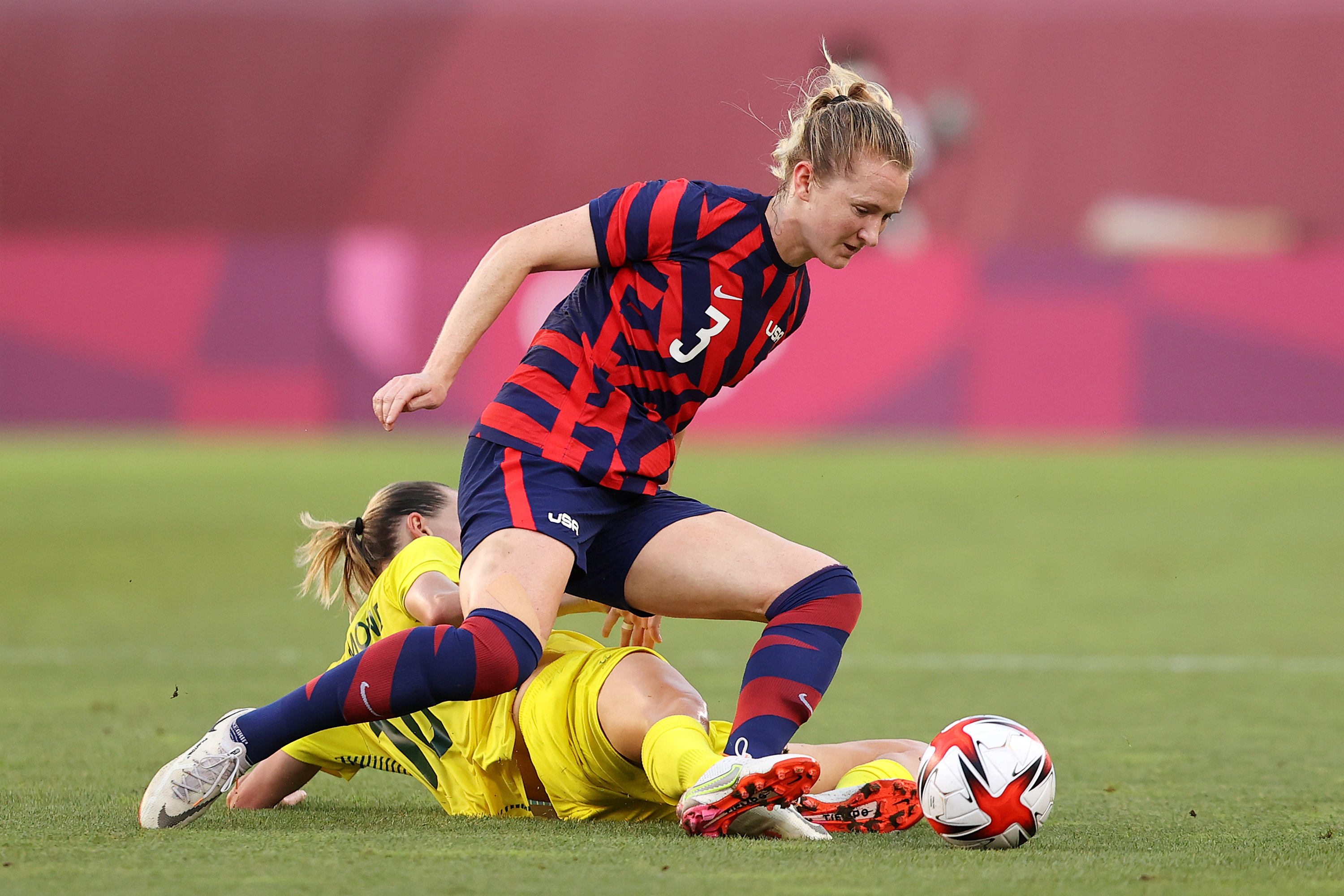 Sam Mewis tries to get past Australia's Emily Van Egmond during the US women's bronze medal match.