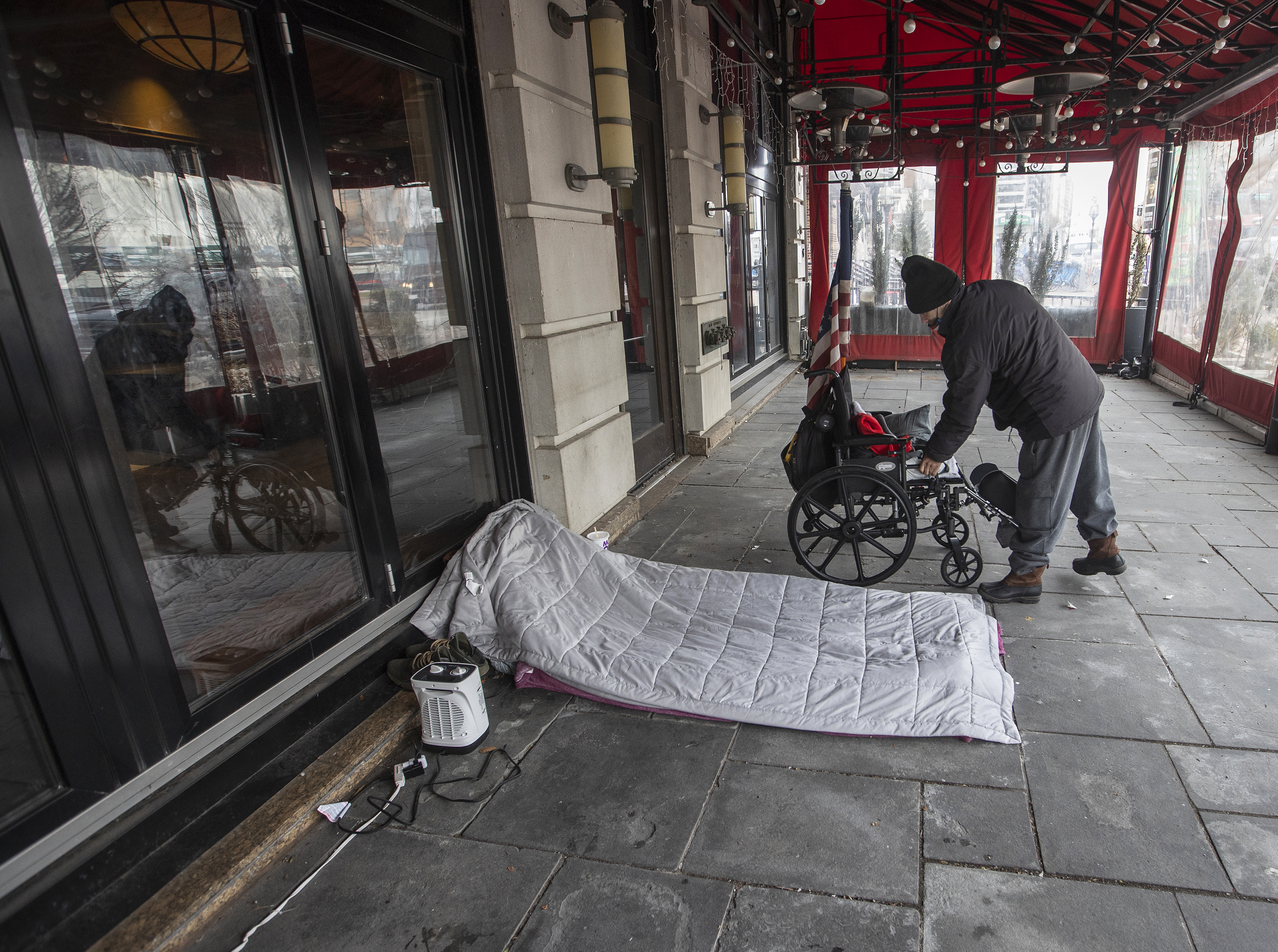 Lefty with his belongings outside Eastern Standard.