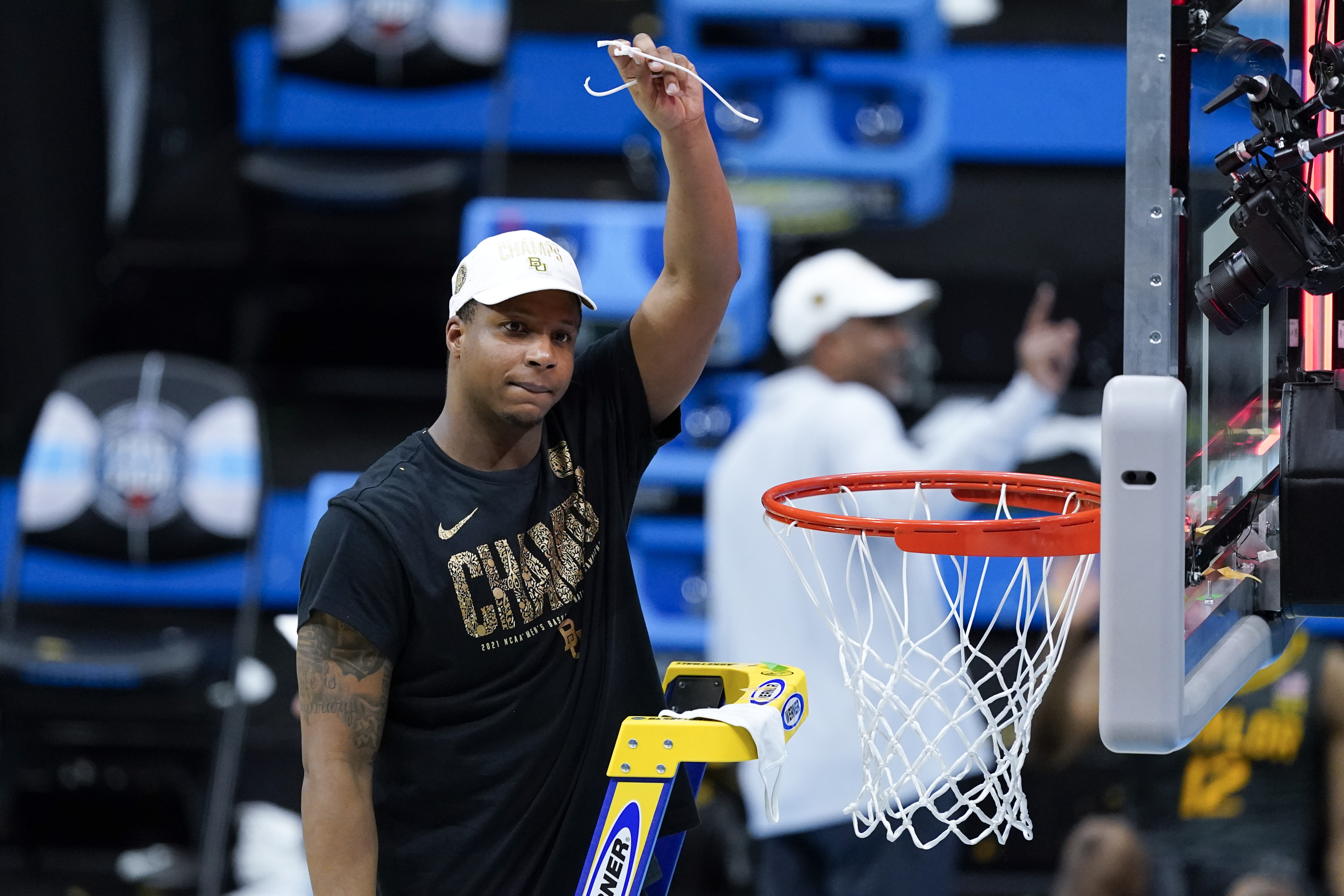 Mark Vital cuts down the net after Monday's win.