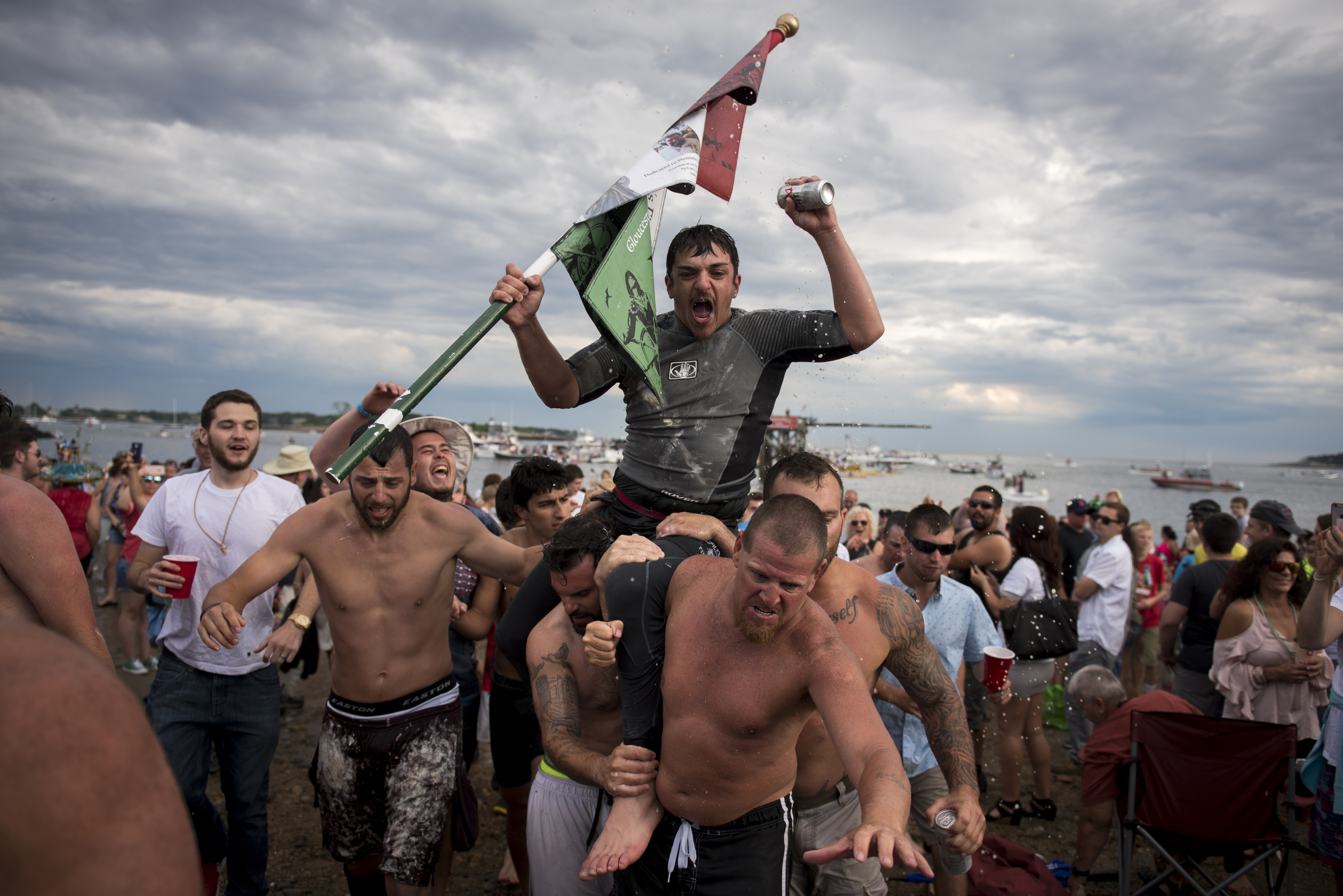 Gloucester residen Jack Wagner celebrates his Sunday greasy pole event win.