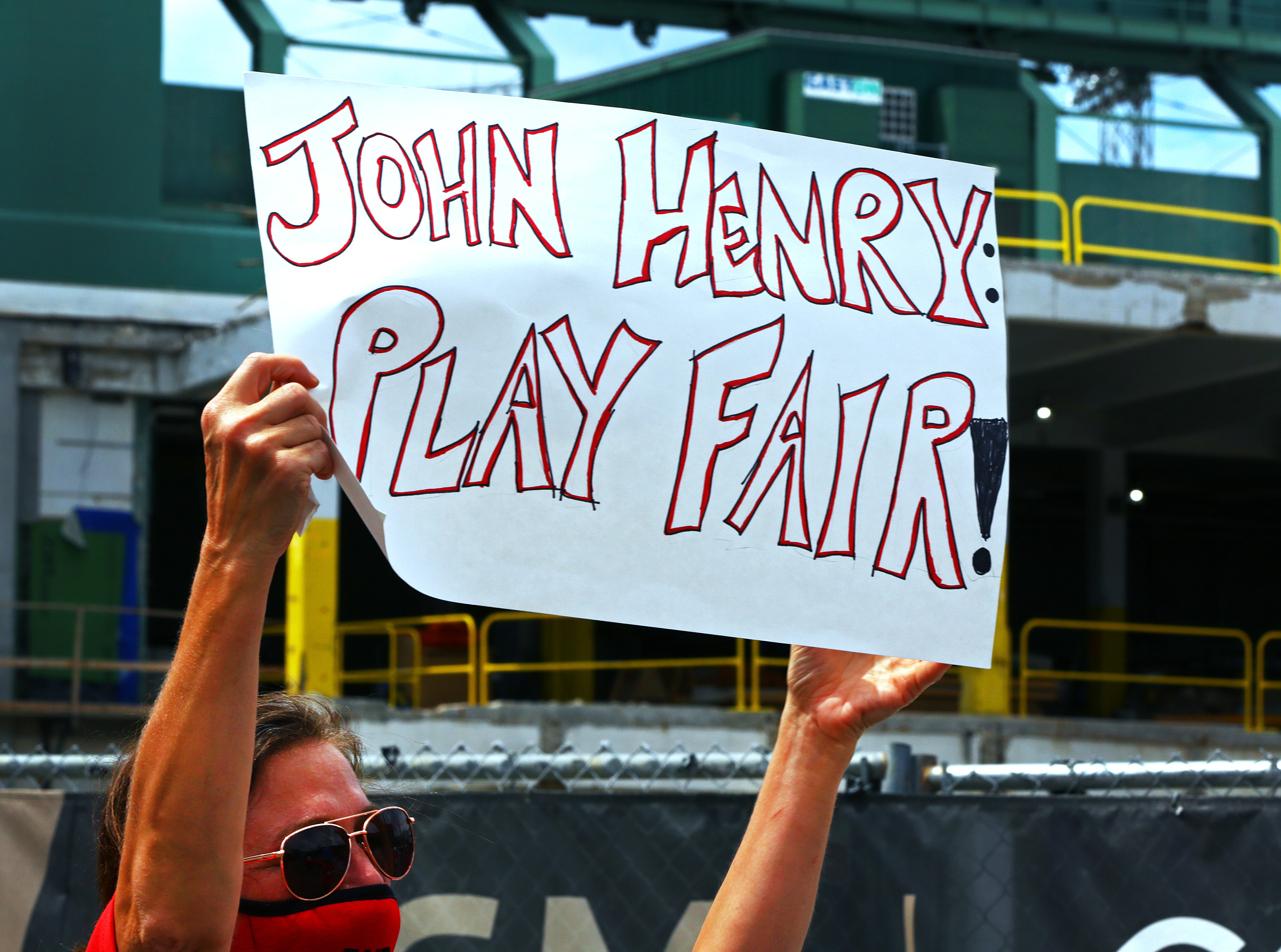 A Boston Newspaper Guild member during a Sunday rally outside Fenway Park.
