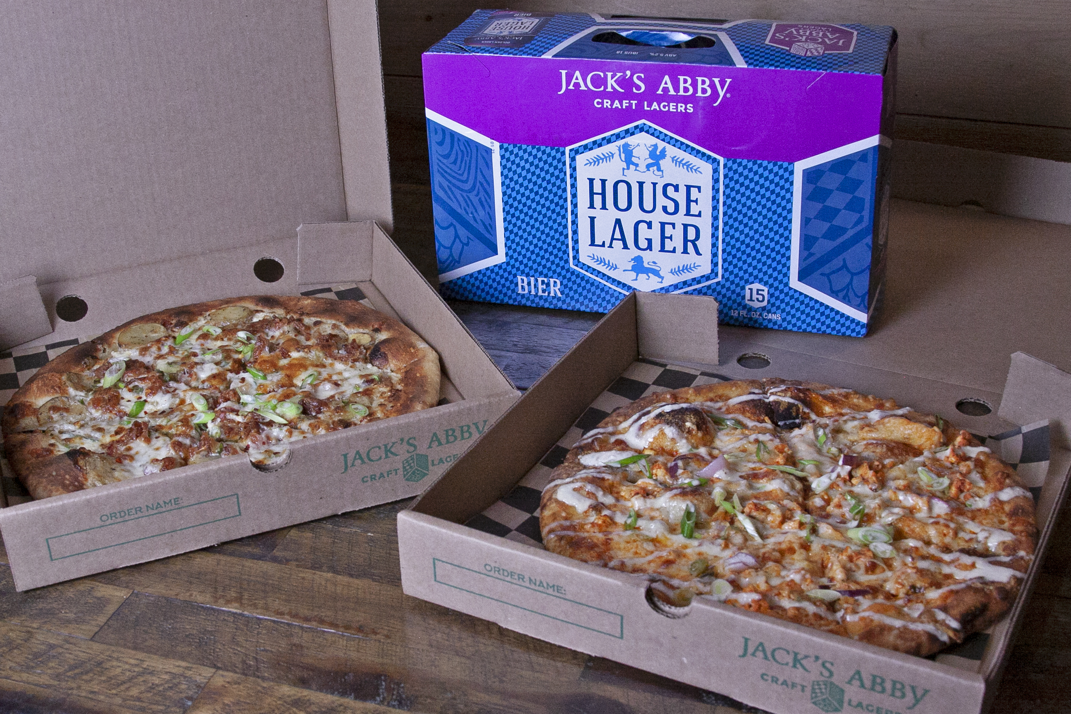 Potato and bacon pizza, buffalo chicken pizza, and beer at Jack's Abby in Framingham.