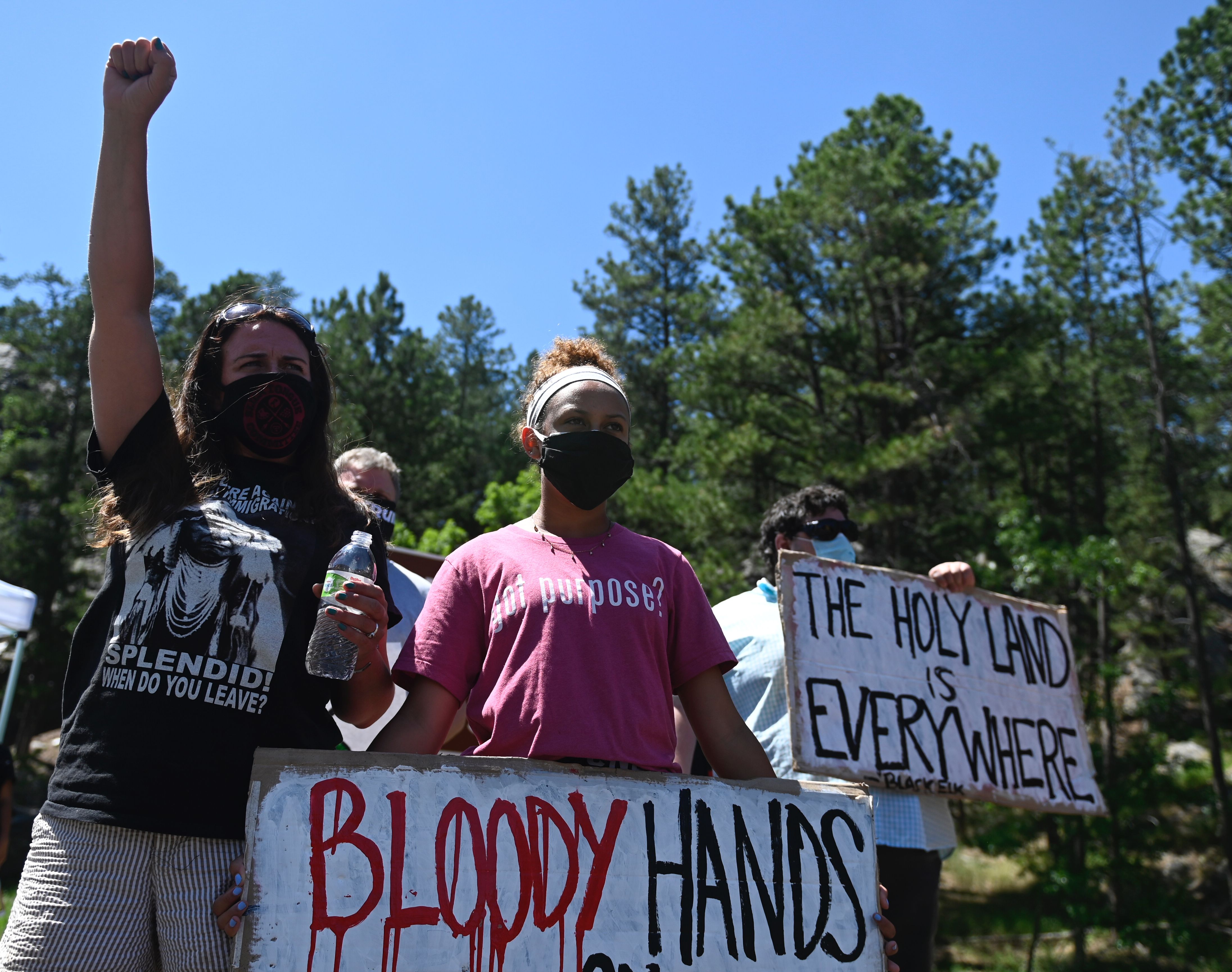 Photos Protesters block road leading to Mount Rushmore ahead of