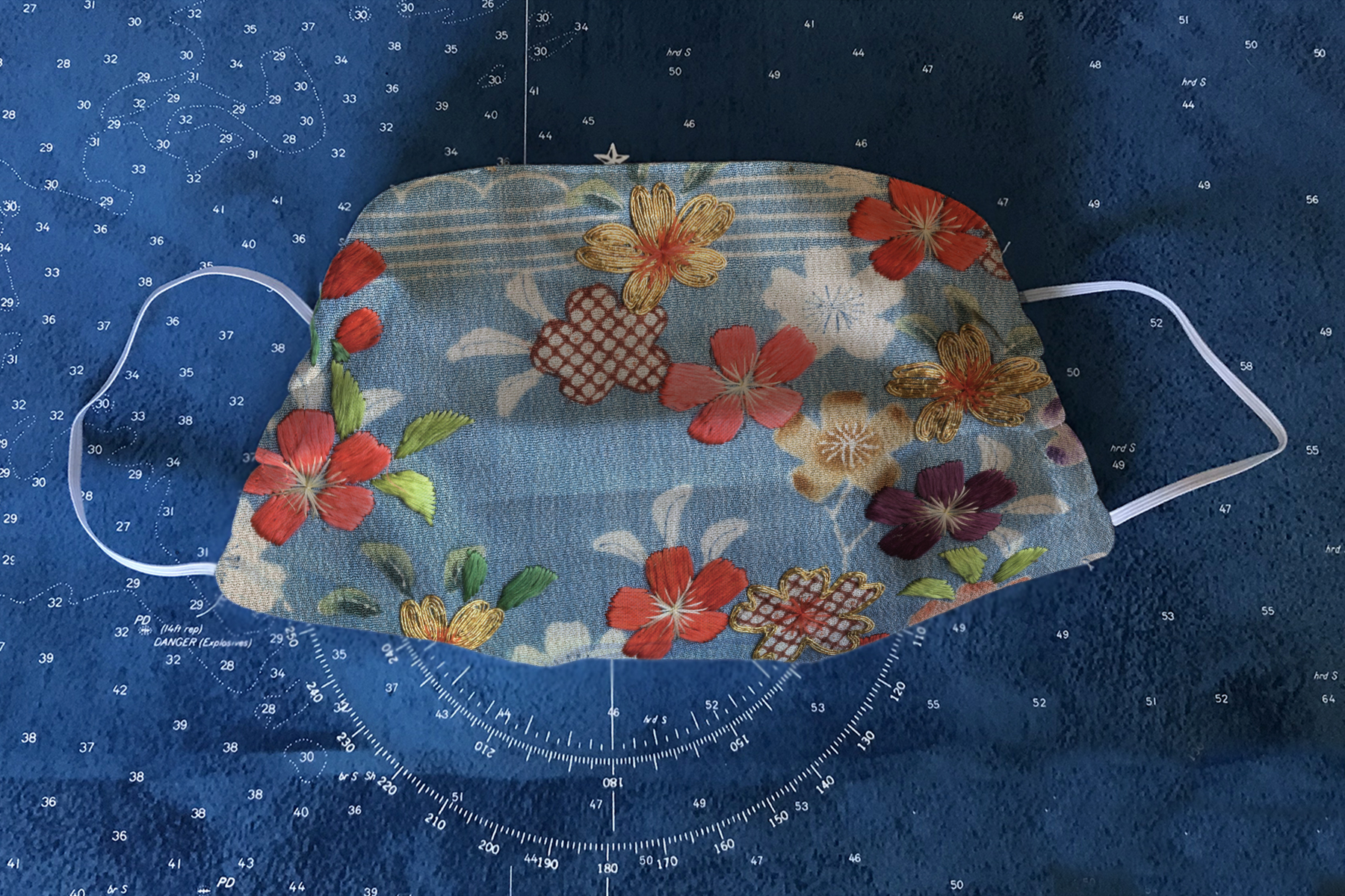 The "Floral Kimono" mask features detail from an early Meiji-era kimono in the museum's collection.