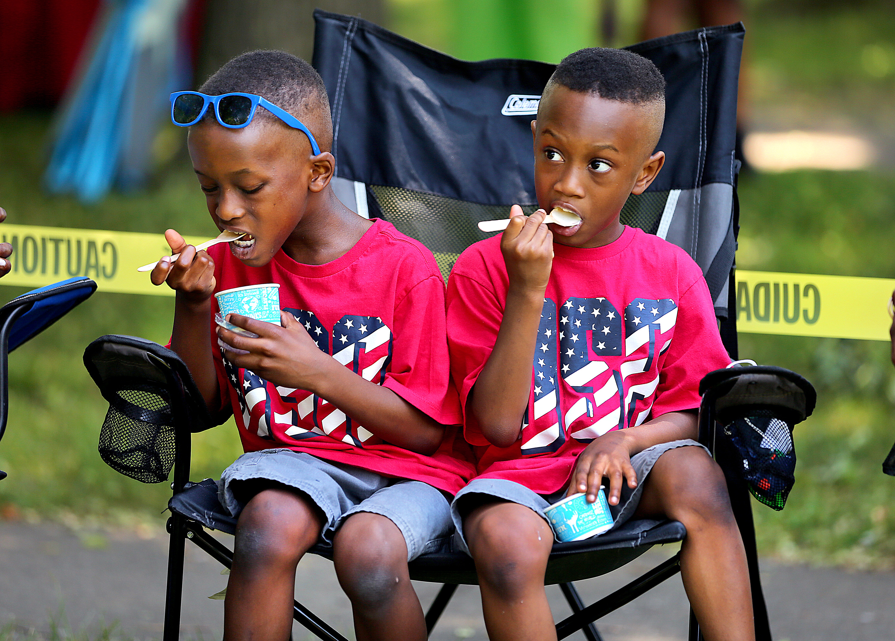 Twins Walter (left) and Winston Mitchell, age 6 from Atlanta, enjoyed ice cream at the Hyde Park celebration.