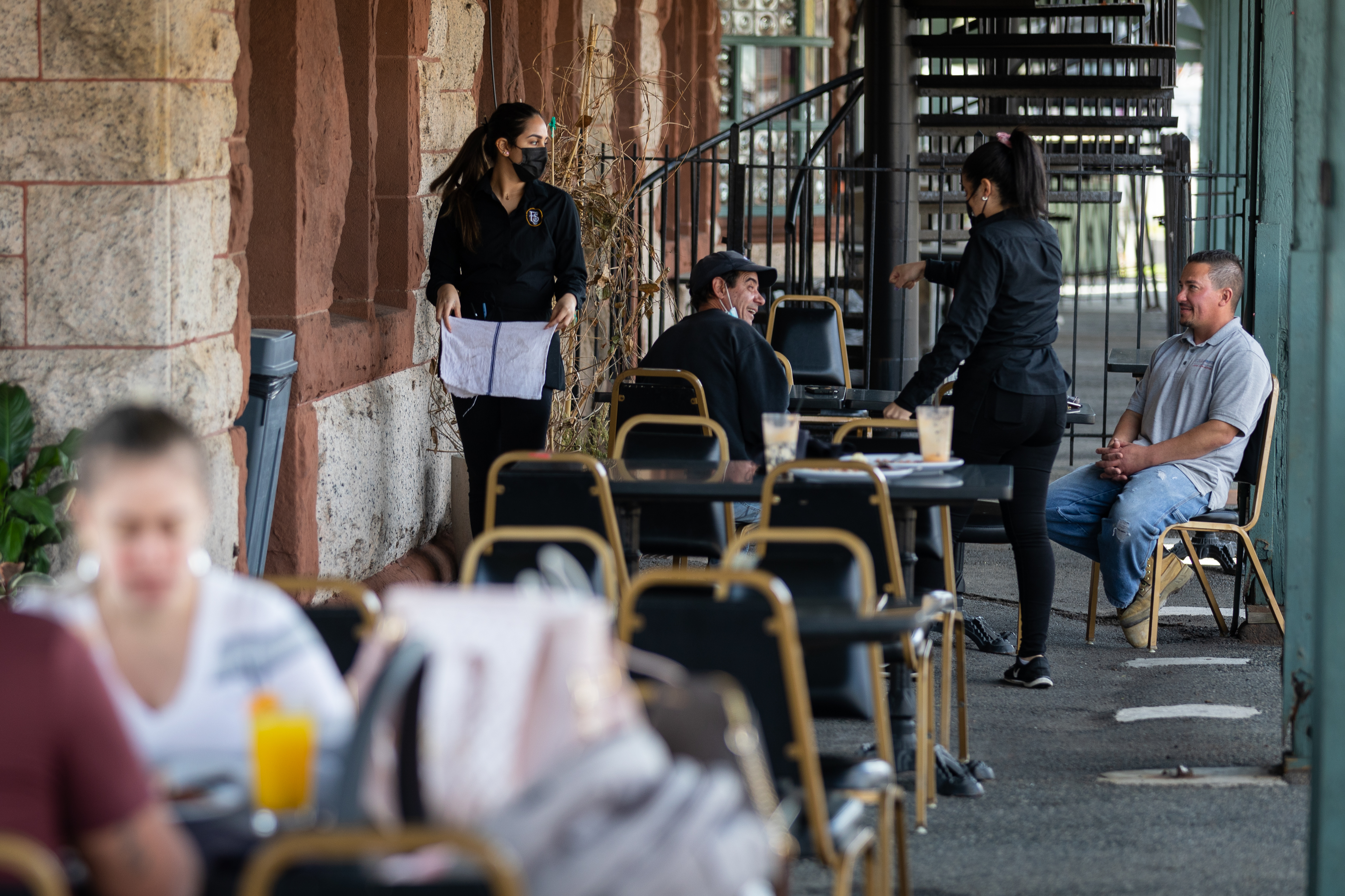 Waitresses tended to patrons enjoying lunch on the outdoor patio at the Framingham Station restaurant last month.