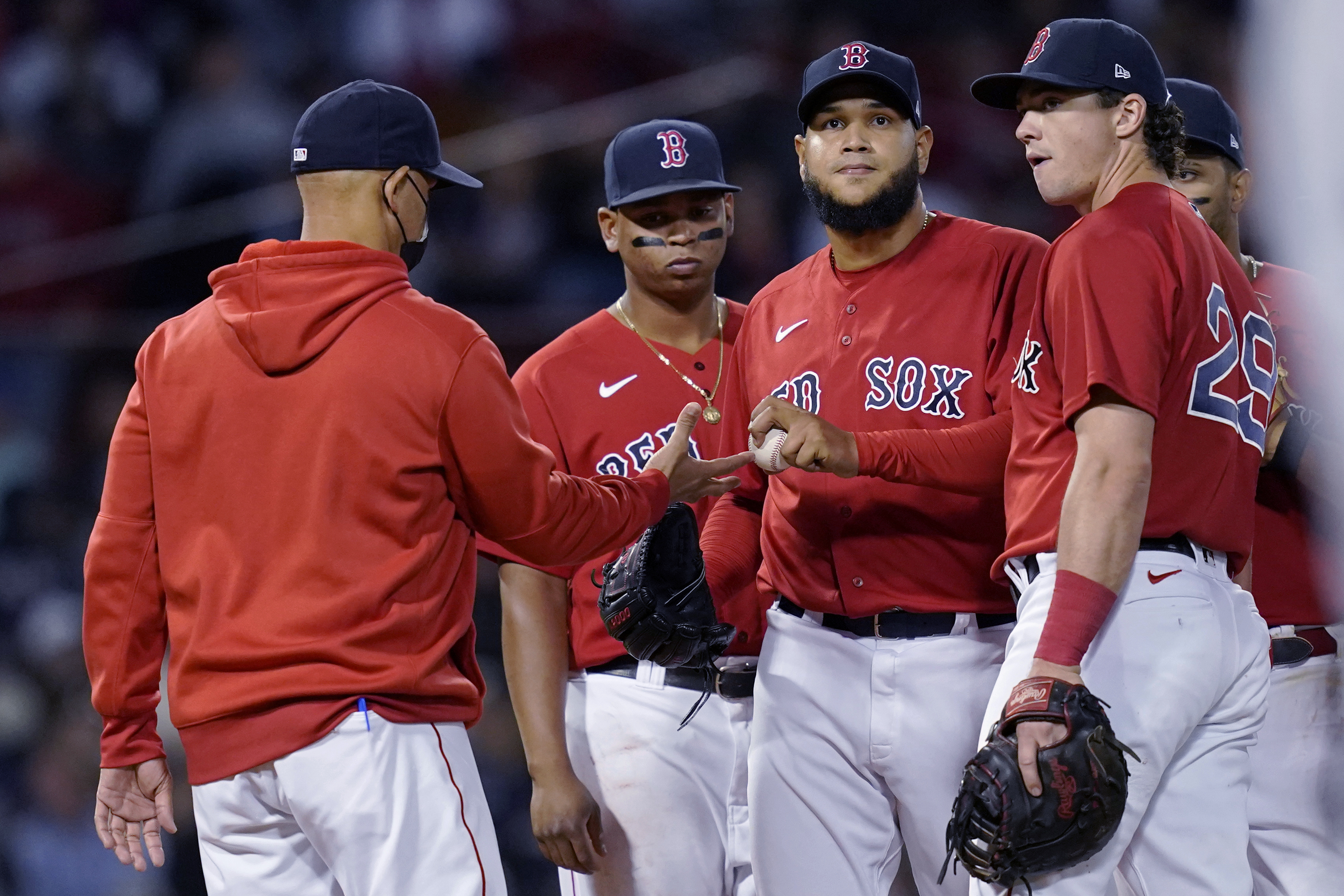 Alex Cora lifts Eduardo Rodriguez in the fifth inning of Thursday's game.
