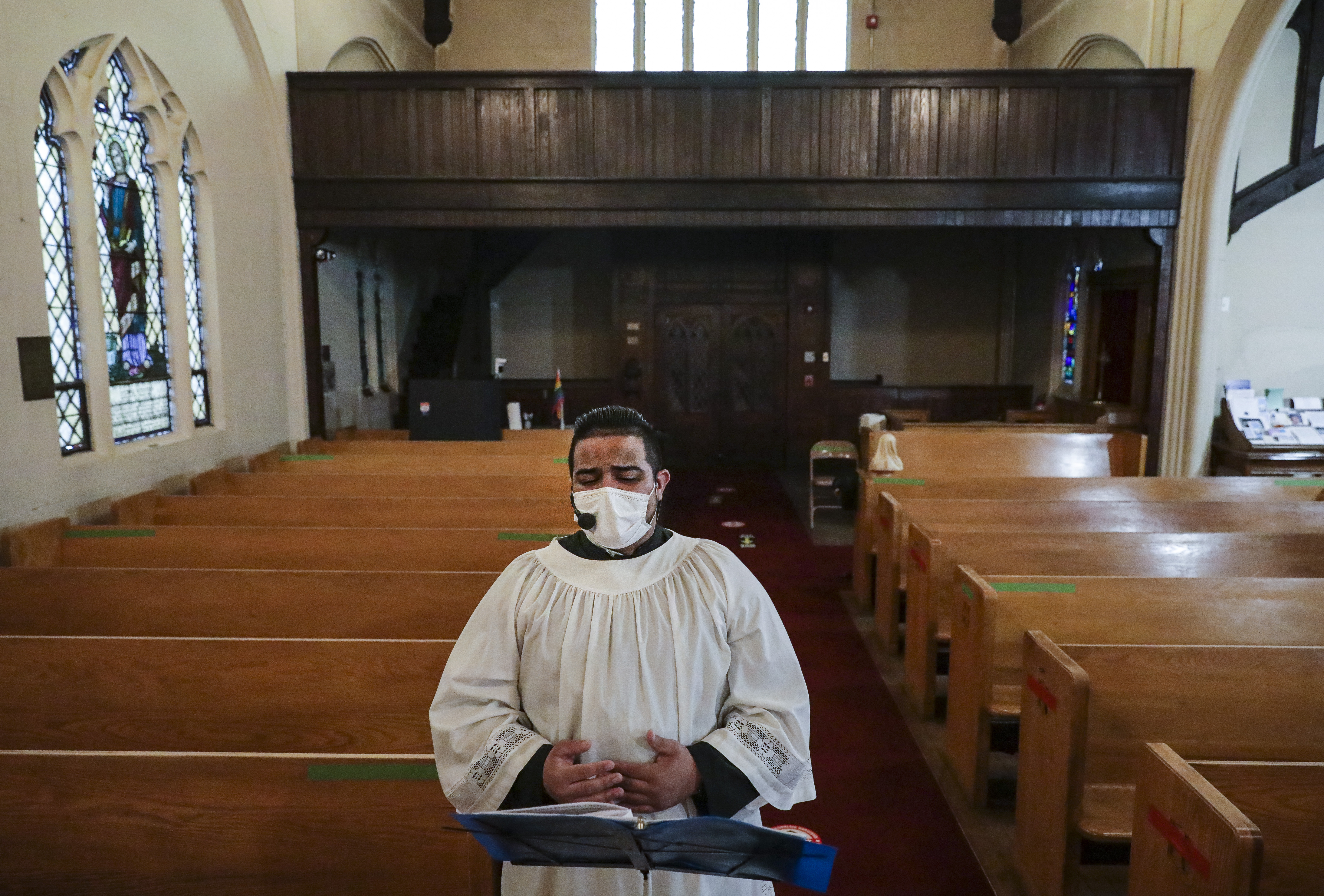 St. Luke-San Lucas junior warden Christian DeJesus Franco sang a hymn during Thursday's service.