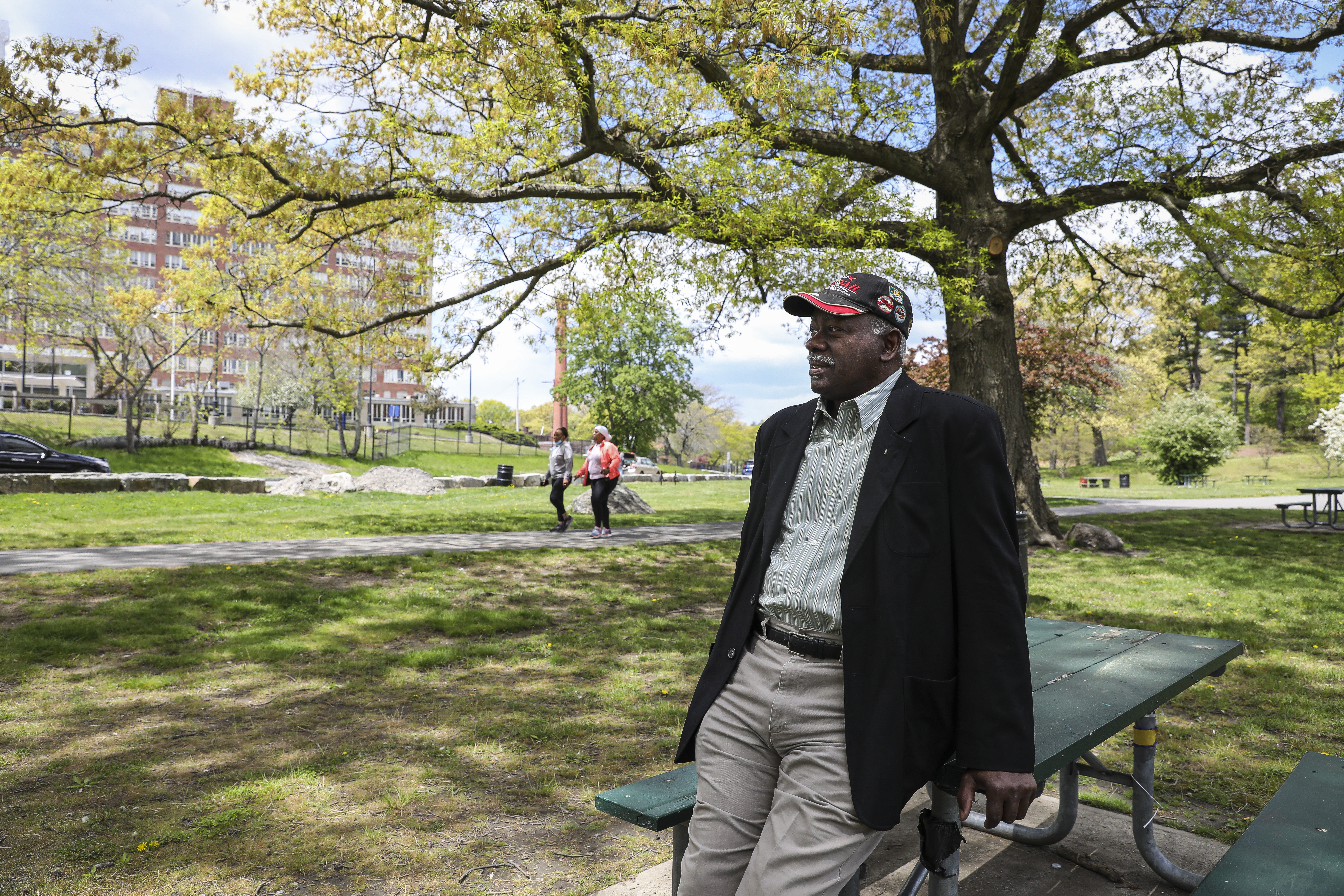 Louis Elisa, president of the Garrison-Trotter Neighborhood Association in Roxbury, and founding member of the Franklin Park Coalition, sat in Franklin Park, near the Lemuel Shattuck Hospital.