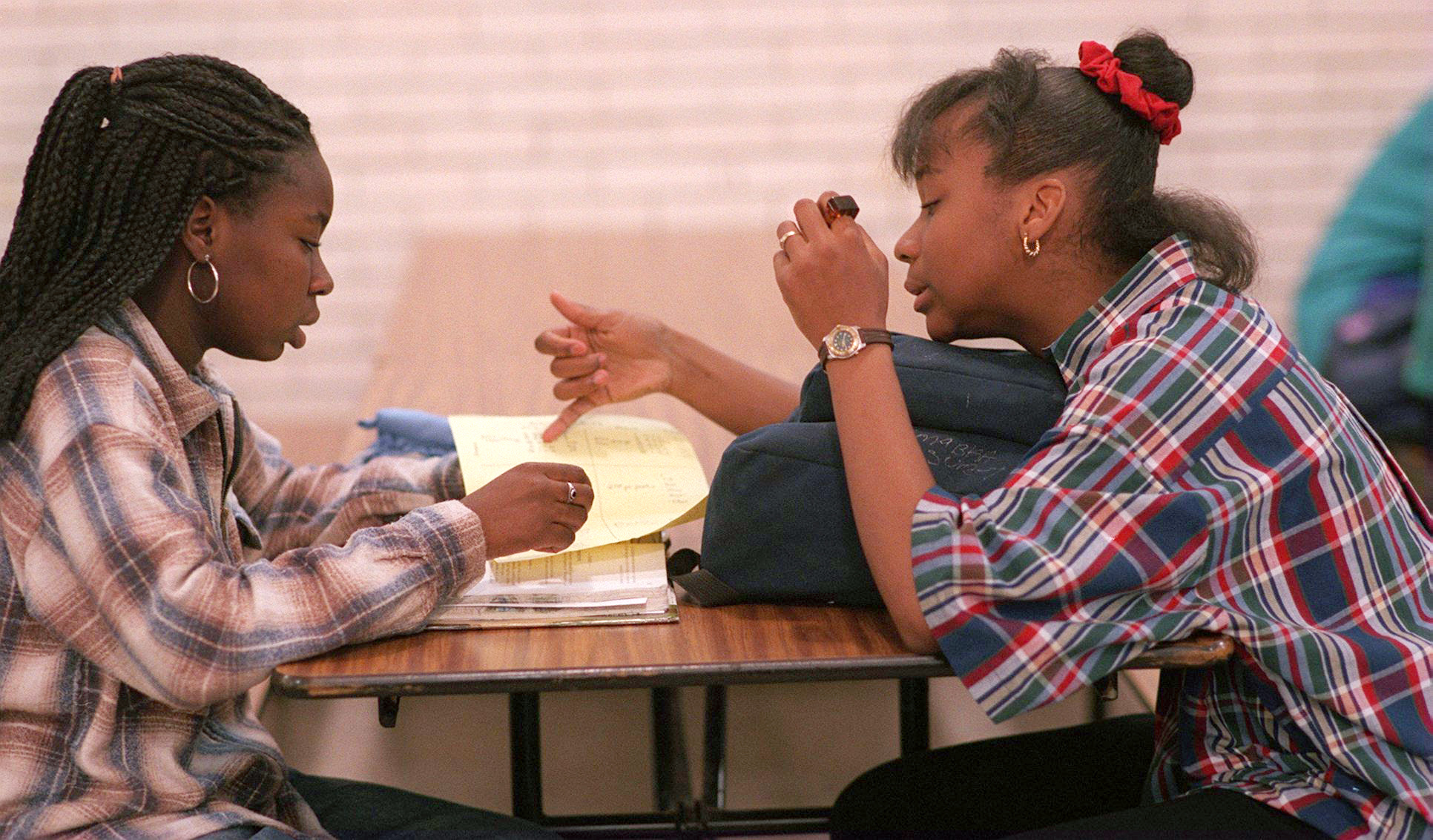 Ama Edzie (left) and Campbell go over homework during the peer tutoring session at Boston Latin School in May 1996.