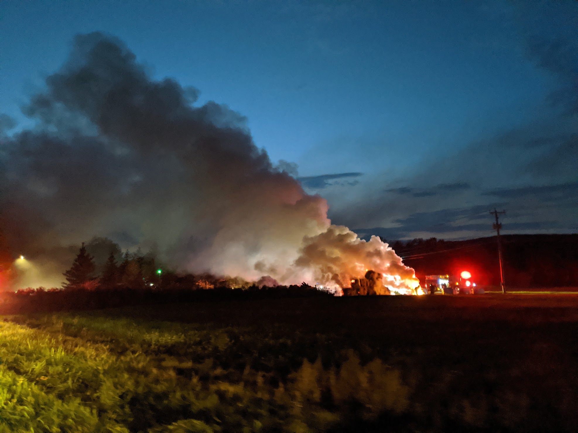 Megan Whalen returned from a walk to find the original sign on Holiday Brook Farm in flames Friday evening.