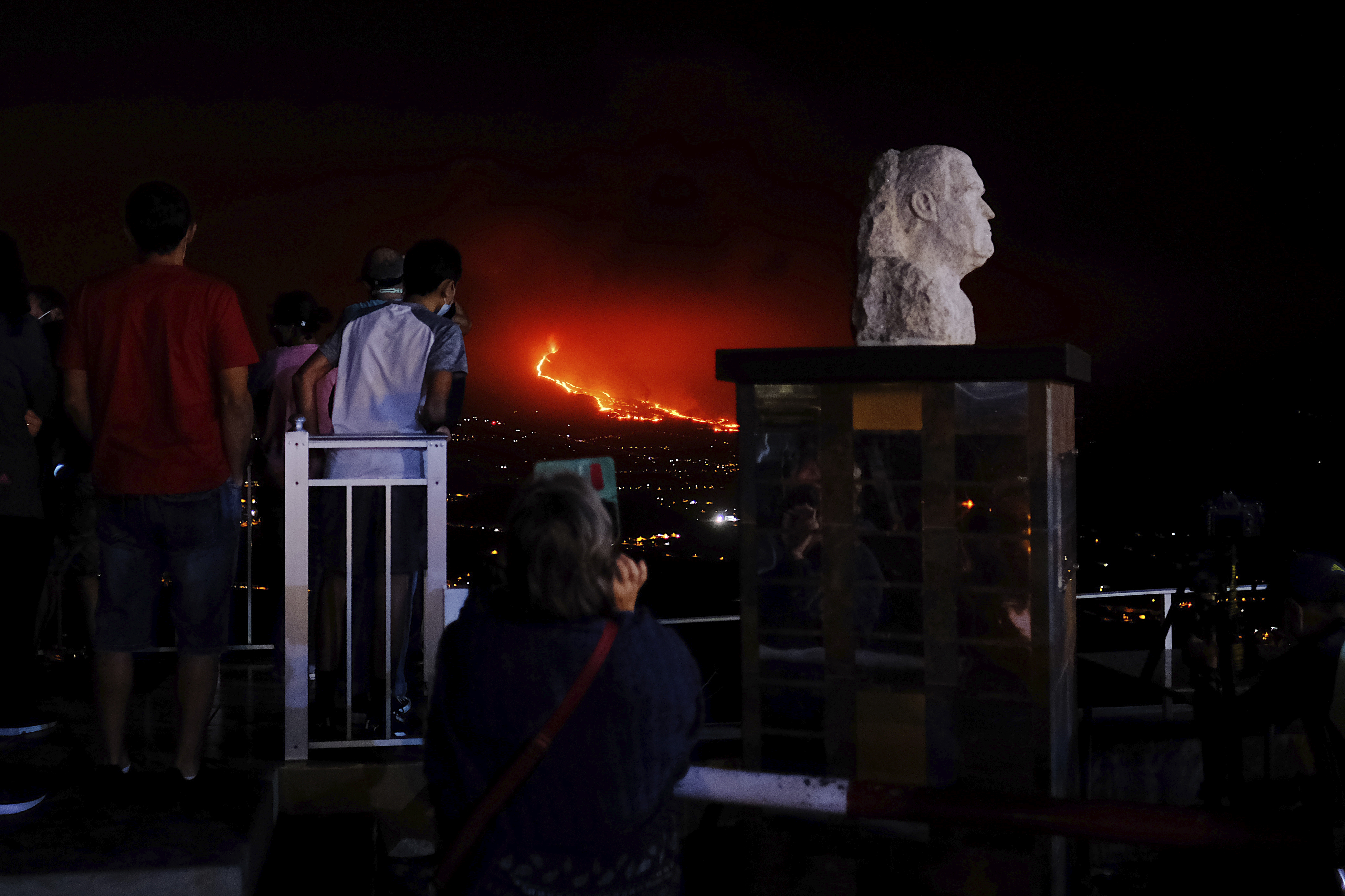 People watched the volcano as it continued to spew lava on the Canary island of La Palma, Spain.