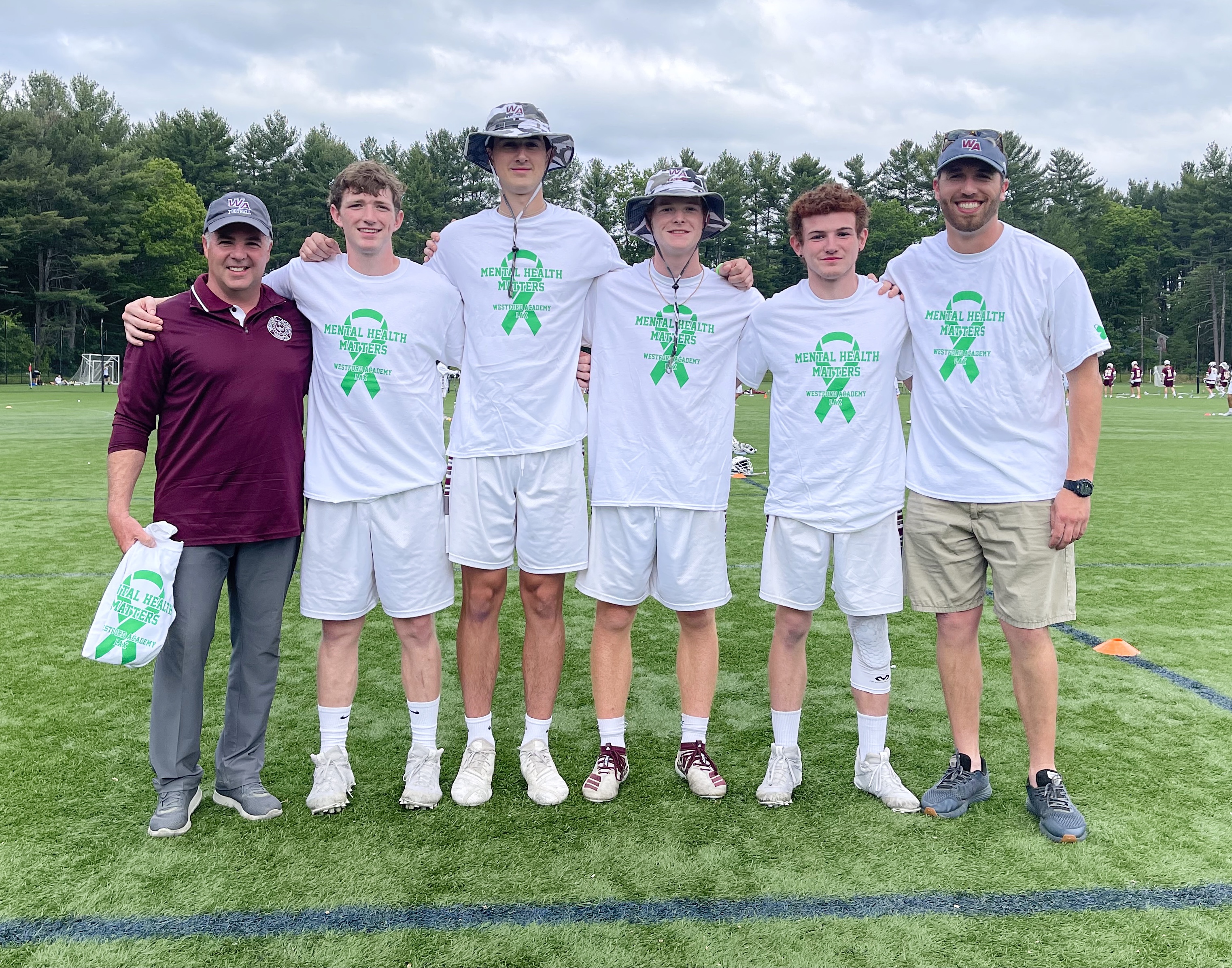 From left, Westford Academy AD Jeff Bunyon, senior captains Brian Ellis, Matty Sepe, Cole Barisano, Craig Tucker, and head coach Matt Hudson.