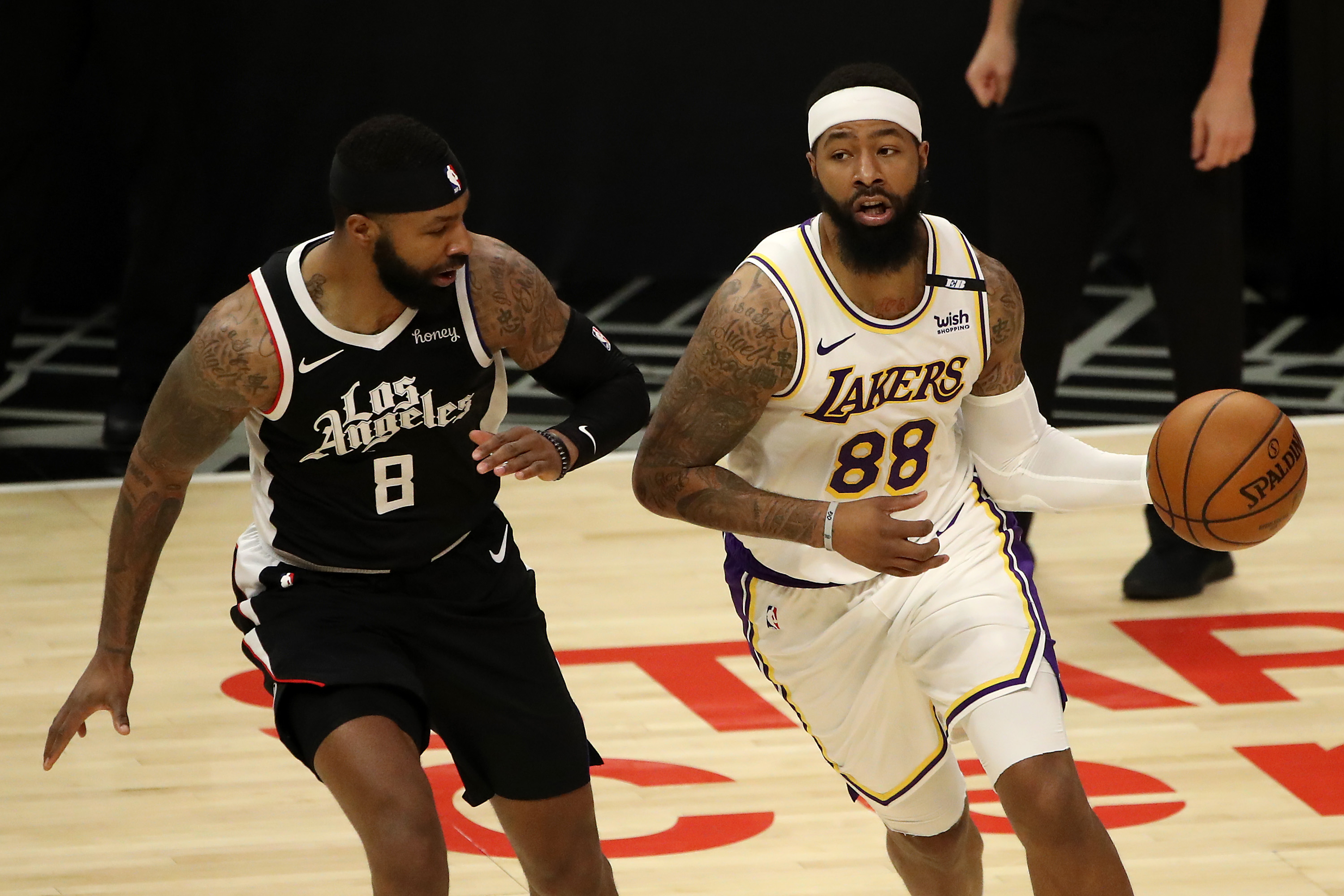 Twins Marcus (left) and Markieff Morris now sit on opposite sides of the Los Angeles divide with the Clippers and Lakers, respectively.