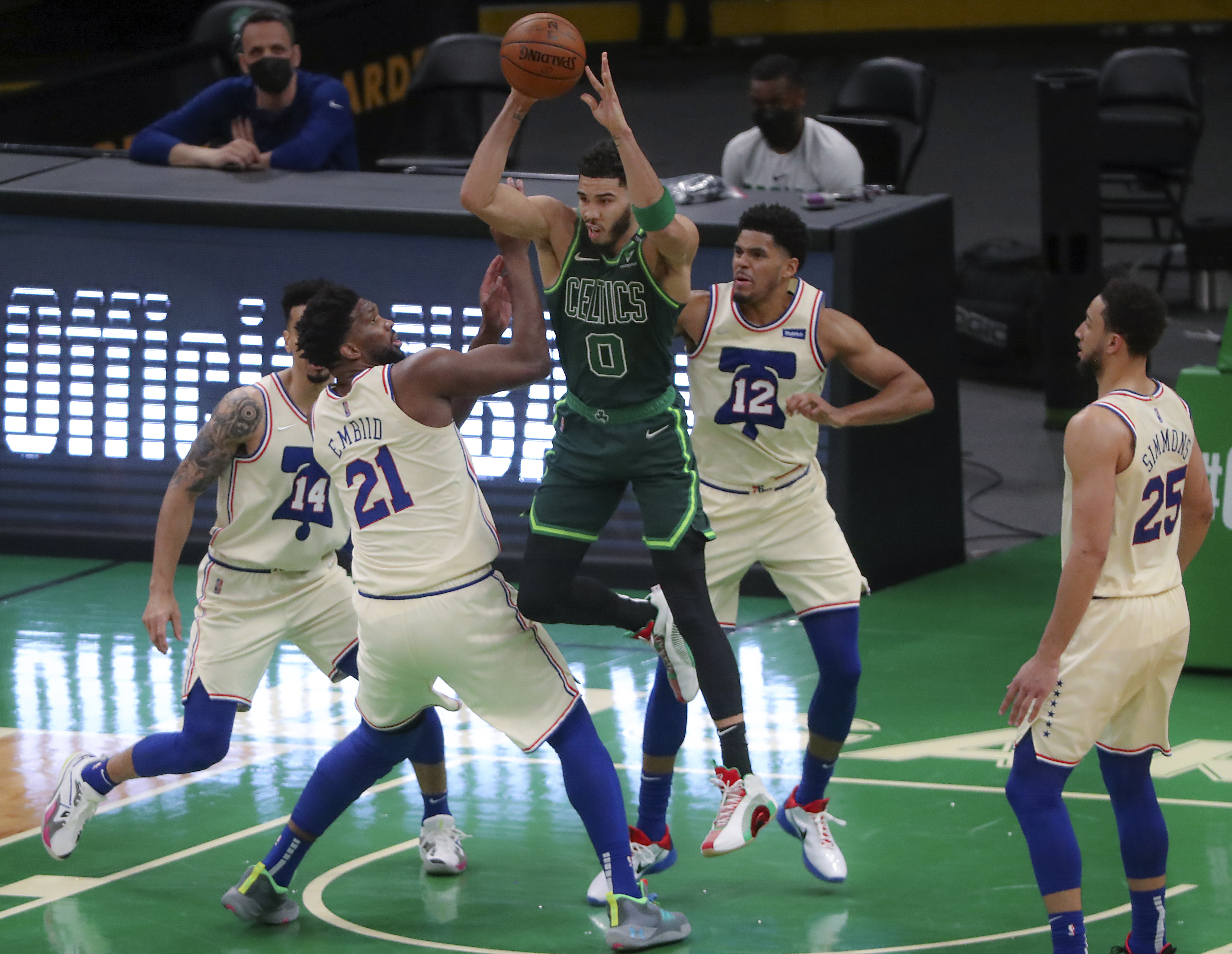 Jayson Tatum looking to pass as he is surrounded by Philadelphia players during the fourth quarter Tuesday night.