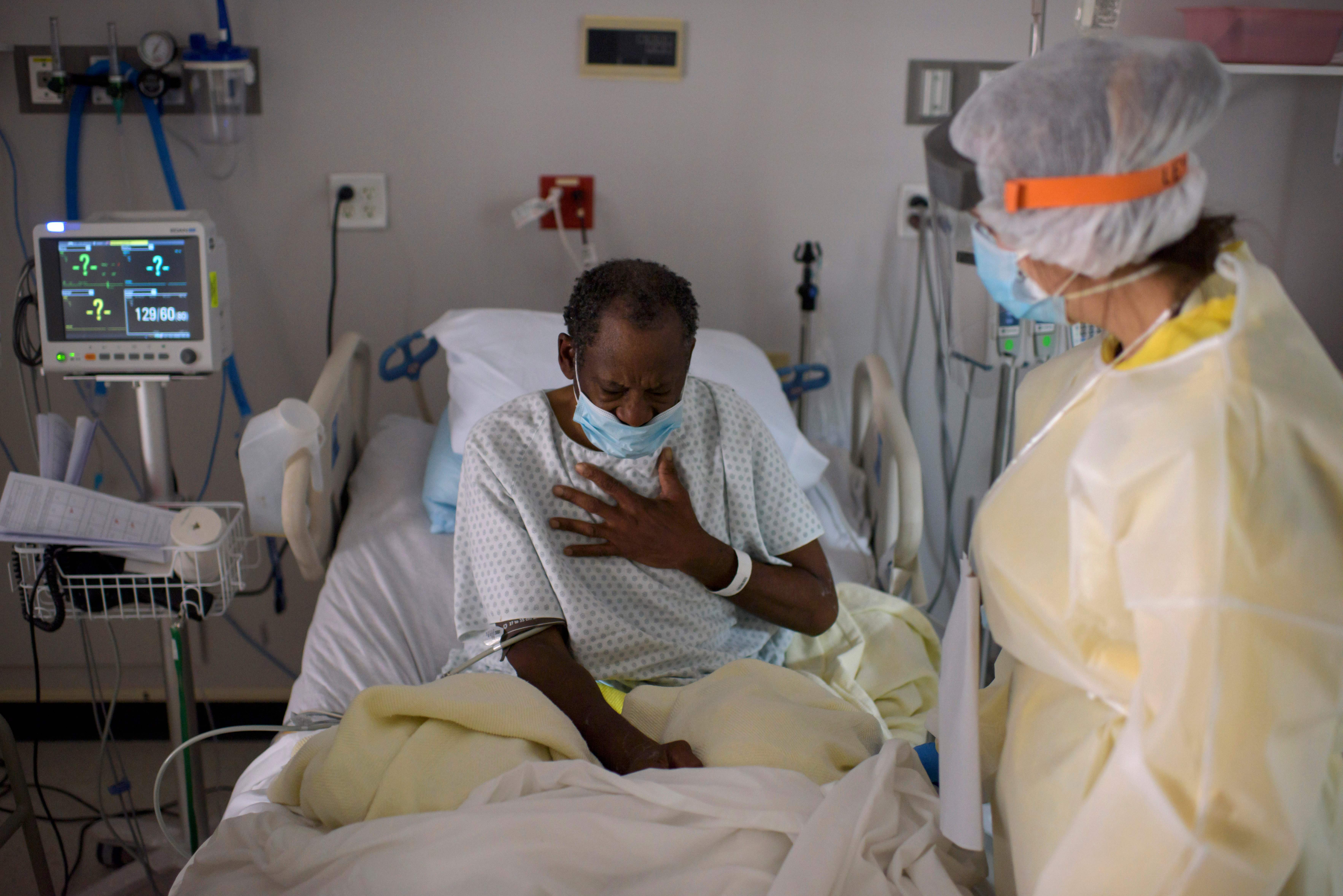 A healthcare worker tended to a patient in the COVID-19 Unit at United Memorial Medical Center in Houston, Texas on July 2, 2020.